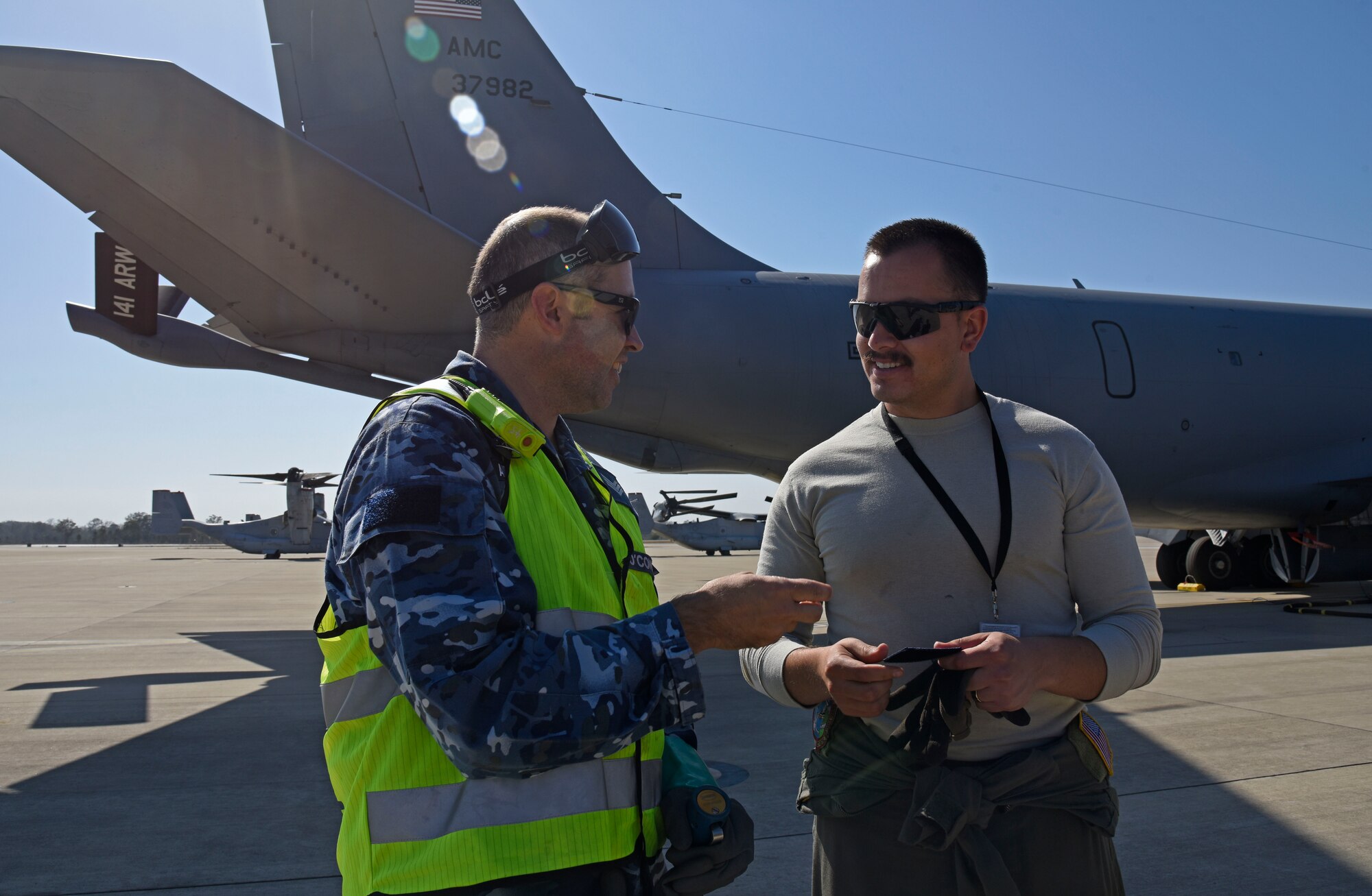 U.S. Air Force Staff Sgt. Austin Garcia, 92nd Aircraft Maintenance Squadron flying crew chief, and Royal Australian Air Force Sgt. Kane O’Connor, 23rd Squadron aircraft refueler, trade unit patches during the first Airborne Warning and Control System World Tour at RAAF Amberley, Australia, Sept. 15, 2019.  During the world tour, Fairchild Air Force Base and Tinker AFB aircrew displayed global reach by successfully completing mission goals at multiple locations to include Alaska, Hawaii and Australia. (U.S. Air Force photo by Senior Airman Jesenia Landaverde)