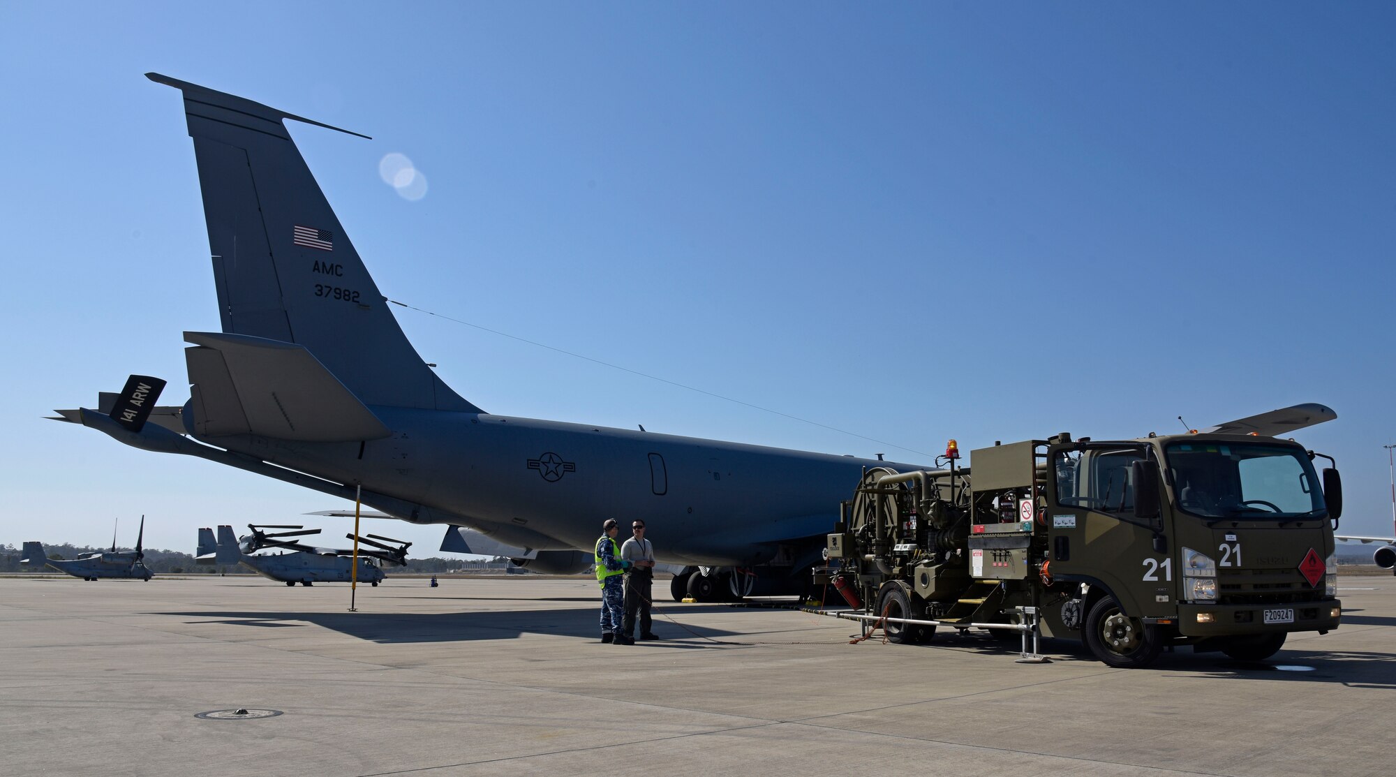 Royal Australian Air Force Amberley logistics crew fuels a U.S. Air Force KC-135 Stratotanker during the first Airborne Warning and Control System World Tour at RAAF Amberley, Australia, Sept. 15, 2019. The world tour was developed by U.S. Air Combat Command for E-3 Sentry aircrew to gain familiarity with transoceanic operations in the Pacific Air Force Region. Fairchild Air Force Base partnered with Tinker AFB during the AWACS world tour to maximize the E-3 flight time. (U.S. Air Force photo by Senior Airman Jesenia Landaverde)