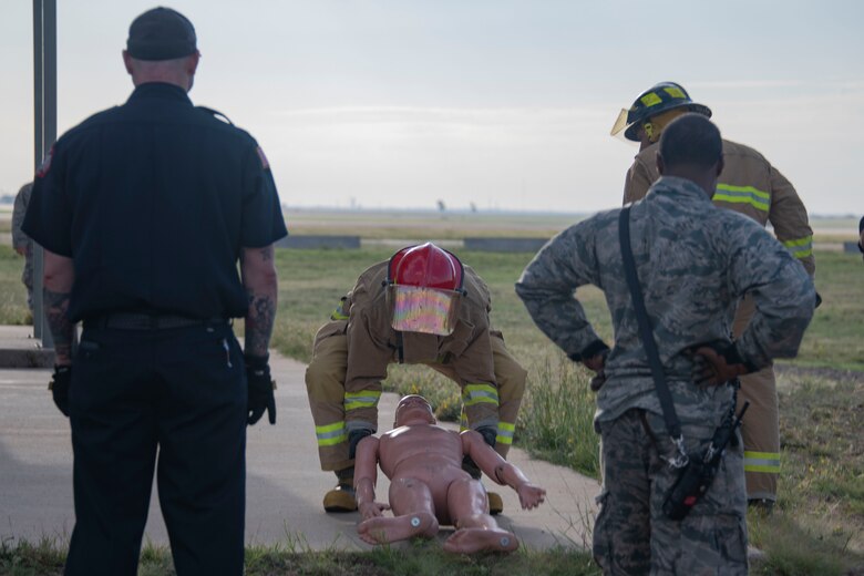 The team for the 54th Aerial Refueling Squadron and 58th Airlift Squadron drag a mannequin during the Squadron Commander and First Sergeant Challenge,