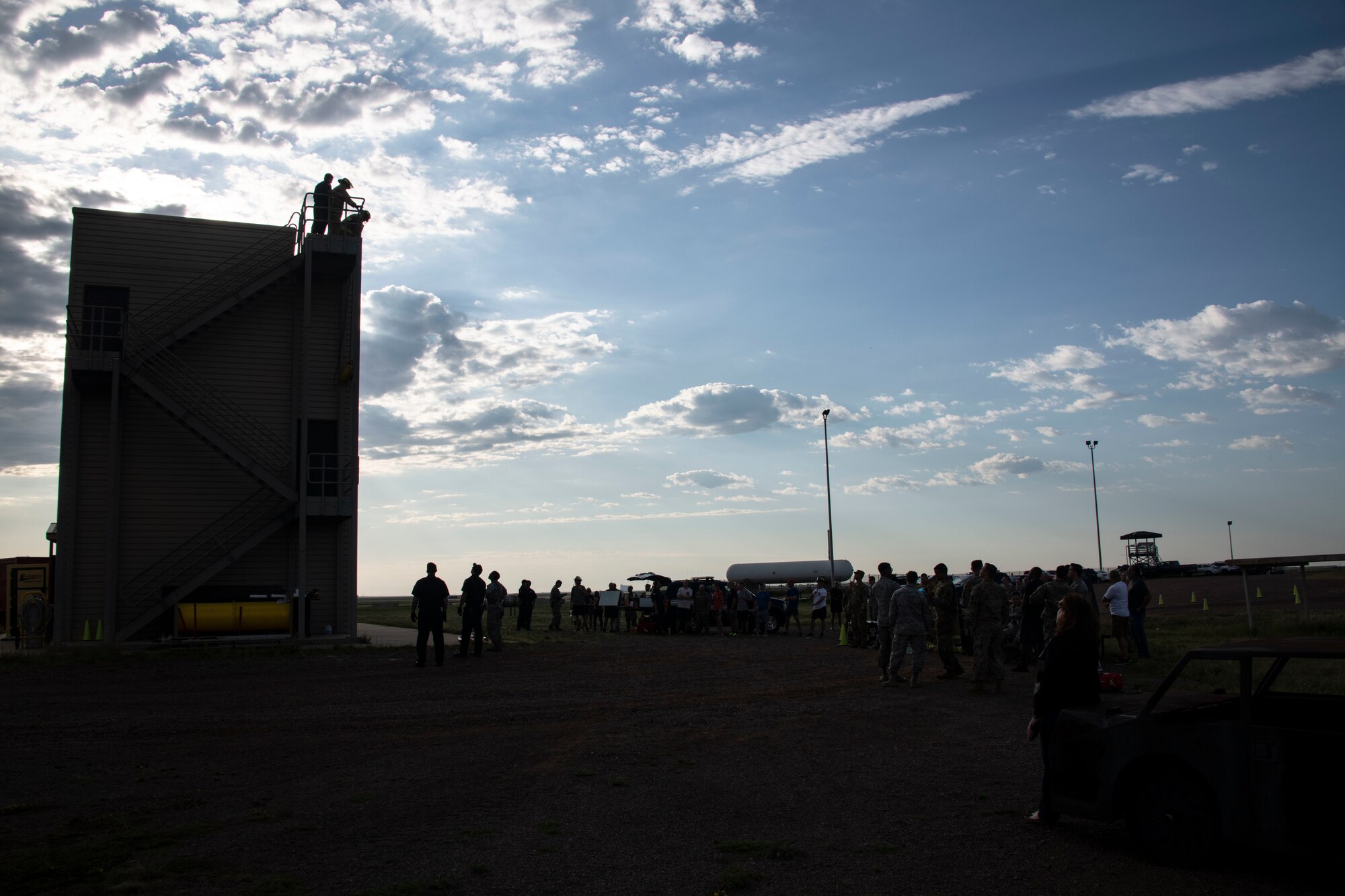Members of the 97th Air Mobility Wing watch participants compete in the Squadron Commander and First Sergeant Challenge, Sept. 26, 2019, at Altus Air Force Base, Okla.