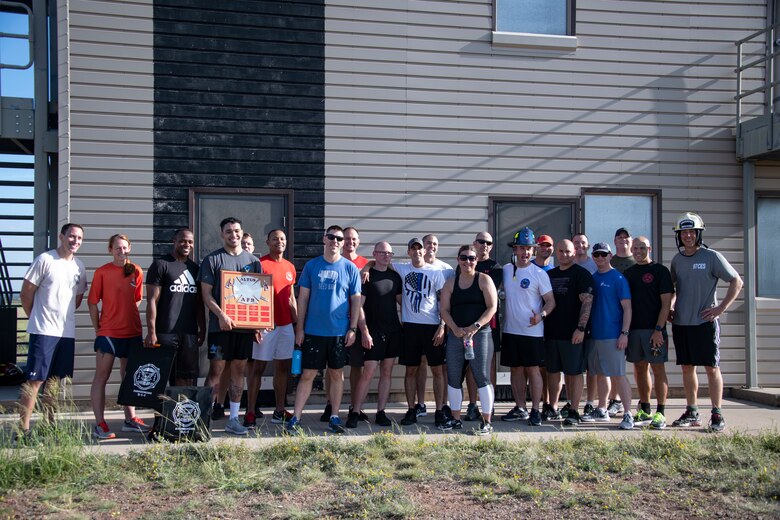 Participants of the Squadron Commander and First Sergeant Challenge pose together after the completion of the event, Sept. 26, 2019, at Altus Air Force Base, Okla. The winner of the 2019 challenge was the team from the 97th Communications Squadron. (U.S. Air Force photo by Senior Airman Cody Dowell)