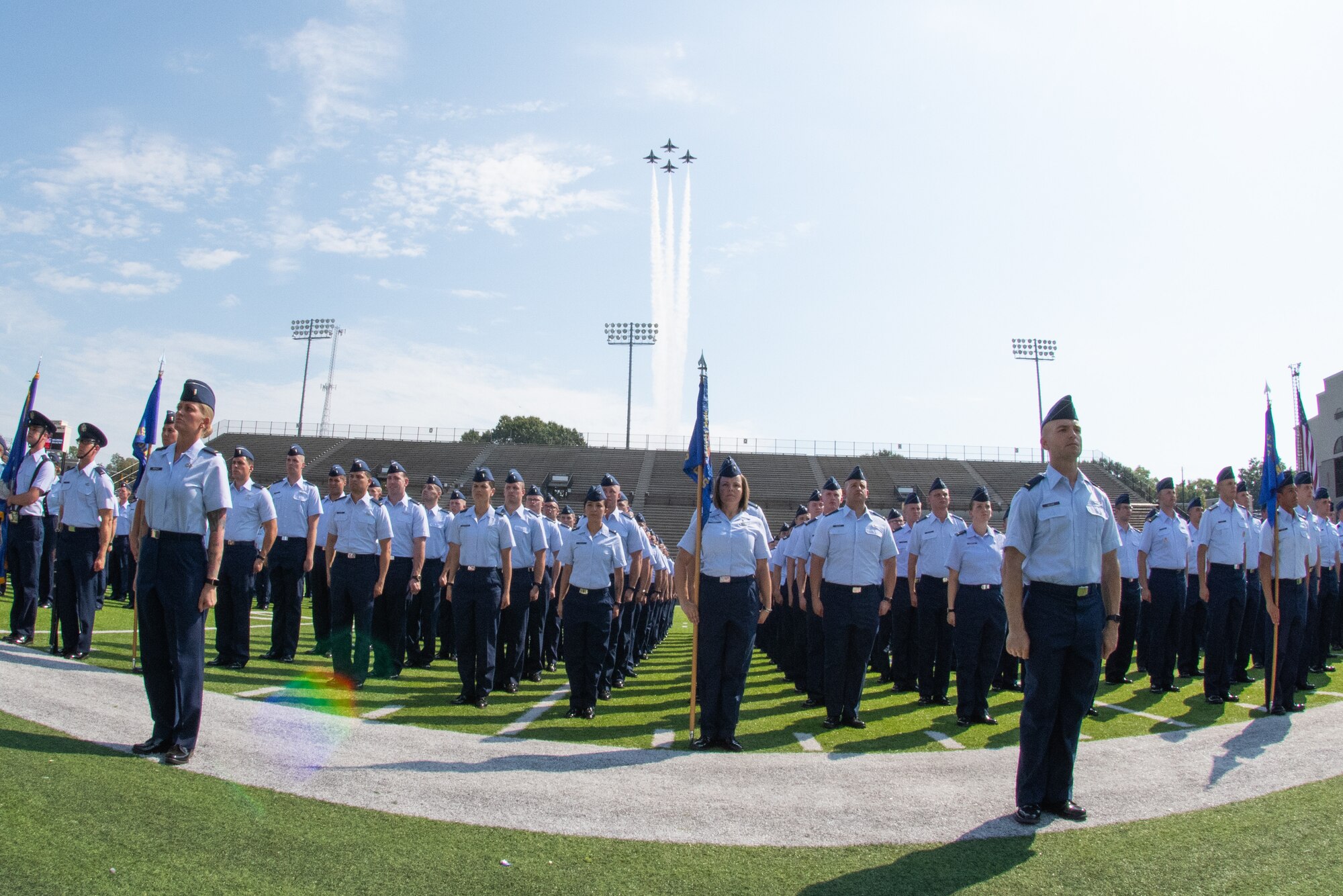 The U.S. Air Force Thunderbirds perform a fly-over during the Officer Training School parade and graduation of class 19-07 Sept. 27, 2019, Montgomery, Alabama. Due to the sheer size of class 19-07, this was the first appearance the U.S. Air Force Thunderbirds have made at an Officer Training School graduation.