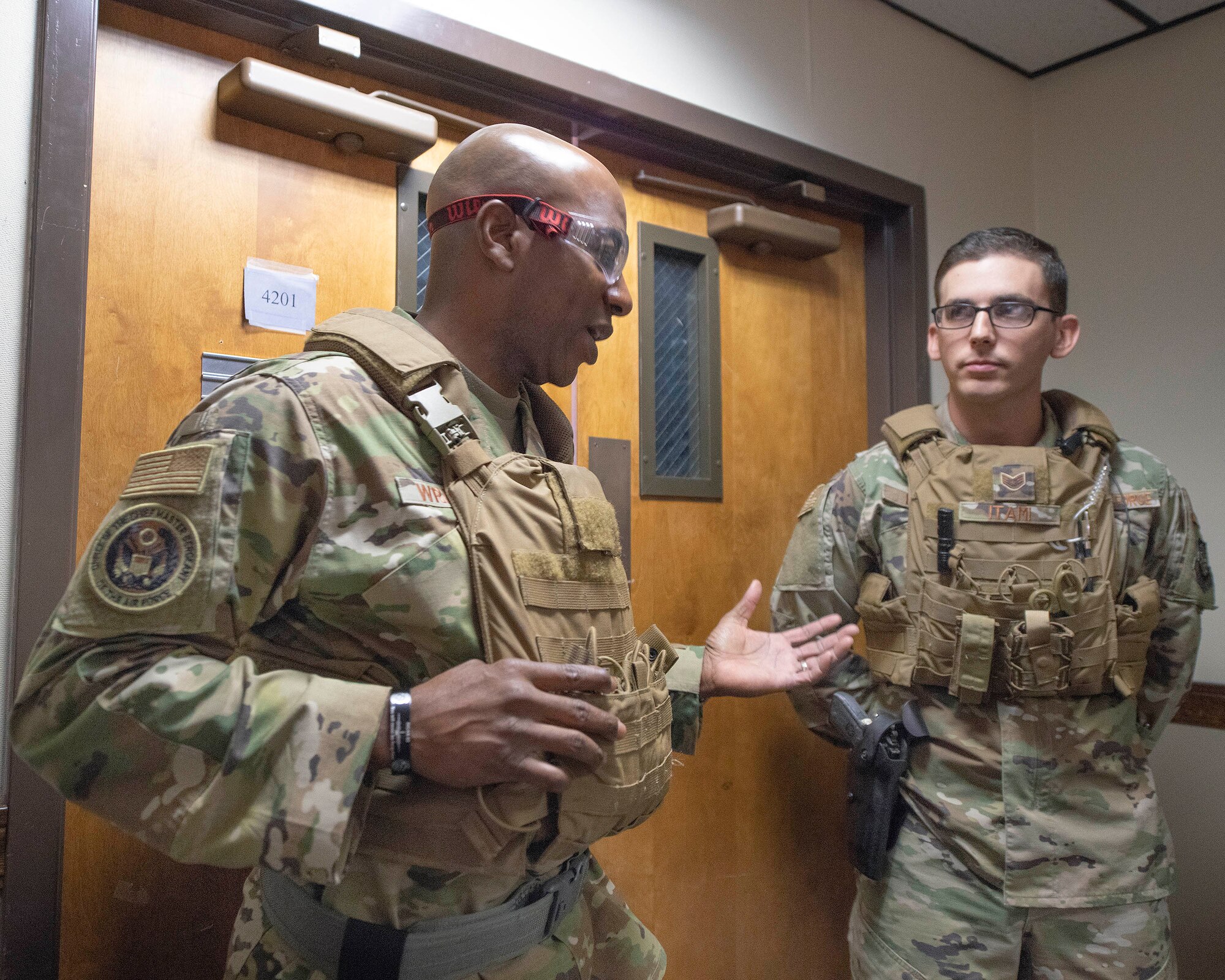 Chief Master Sgt. of the Air Force Kaleth O. Wright speaks to a security forces patrolman.