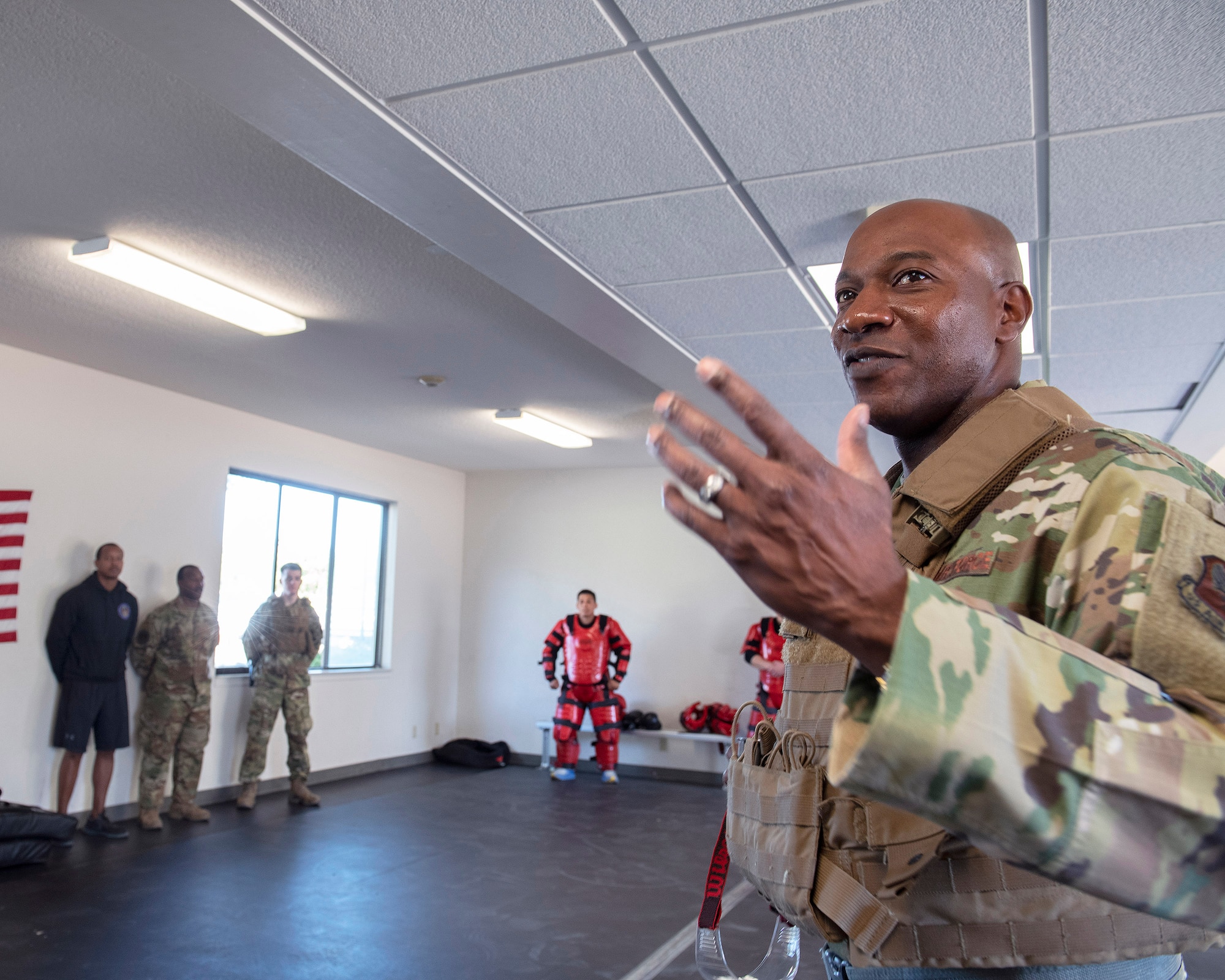 Chief Master Sgt. of the Air Force Kaleth O. Wright, right, speaks with Airmen from the 60th Security Forces Squadron