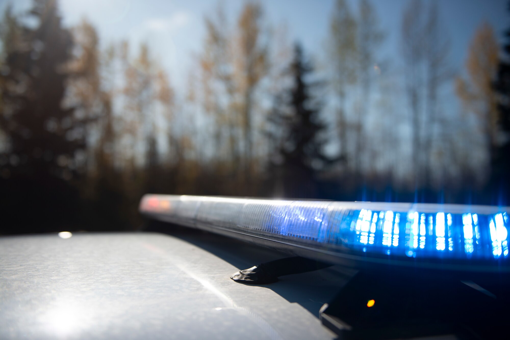 A light bar on a 673d Security Forces Squadron patrol car demonstrates its emergency lights at Joint Base Elmendorf-Richardson, Alaska, Sept. 26, 2019. The display showcased the importance of yielding to an emergency vehicle’s lights and siren.