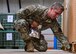 U.S. Air Force Staff Sgt. Joshua Reid, 355th Security Forces military working dog trainer, sets up a narcotic/explosive detection exercise for an MWD team at Davis-Monthan Air Force Base, Arizona, Sept. 24, 2019. MWDs are specialized in detecting either narcotics or explosives throughout their careers. (U.S. Air Force photo by Airman 1st Class Kristine Legate)