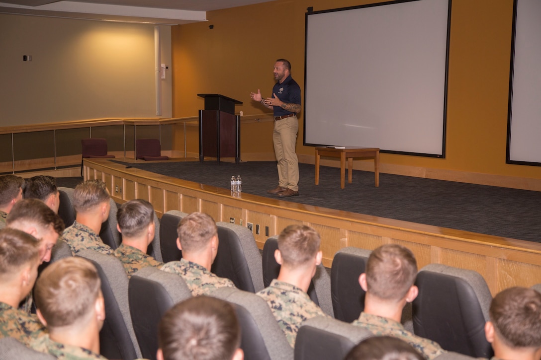 Chad M. Robichaux, founder of Might Oaks Foundation, speaks to Marines and Sailors from Marine Forces Special Operations Command, during a military resiliency event on Marine Corps Base Camp Lejeune, N.C., August 12, 2019. The founder of the Mighty Oaks Foundation, provided information about the Mighty Oaks Warrior Program. The program uses a grassroots approach, empowering veterans and active duty members to begin their healing and then be a positive impact on those in their surrounding communities. Through the methodologies used and the evaluation of those who have experienced combat, Robichaux and his team discovered that the same methods used to “heal” PTSD are equally effective if implemented prior to traumatic events such as those experienced in combat. Knouse, Kent, and Evans have all attended Robichaux’s program, bringing back with them a new understanding of post-traumatic stress and different tools to help combat the effects. Robichaux and his wife, Kathy, founded Mighty Oaks in 2011 with the goal to share their story through the trials of PTS and assist others along the path to recovery and success. (U.S. Marine Corps photo by Sgt. Bryann K. Whitley)