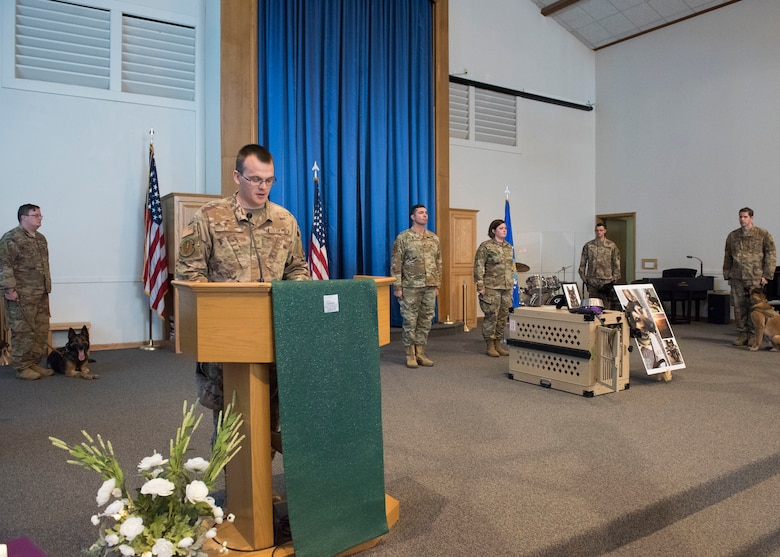 Tech. Sgt. Dustin Cain, 366th Security Forces military working dog kennel master, speaks at a ceremony held to comemorate MWD Alf V198 September 26, 2019, at Mountain Home Air Force Base, Idaho. Alf served for six years in the United States Air Force and during that time achieved great accomplishments in support of the United States of America. (U.S Air Force photo by Senior Airman Tyrell Hall)