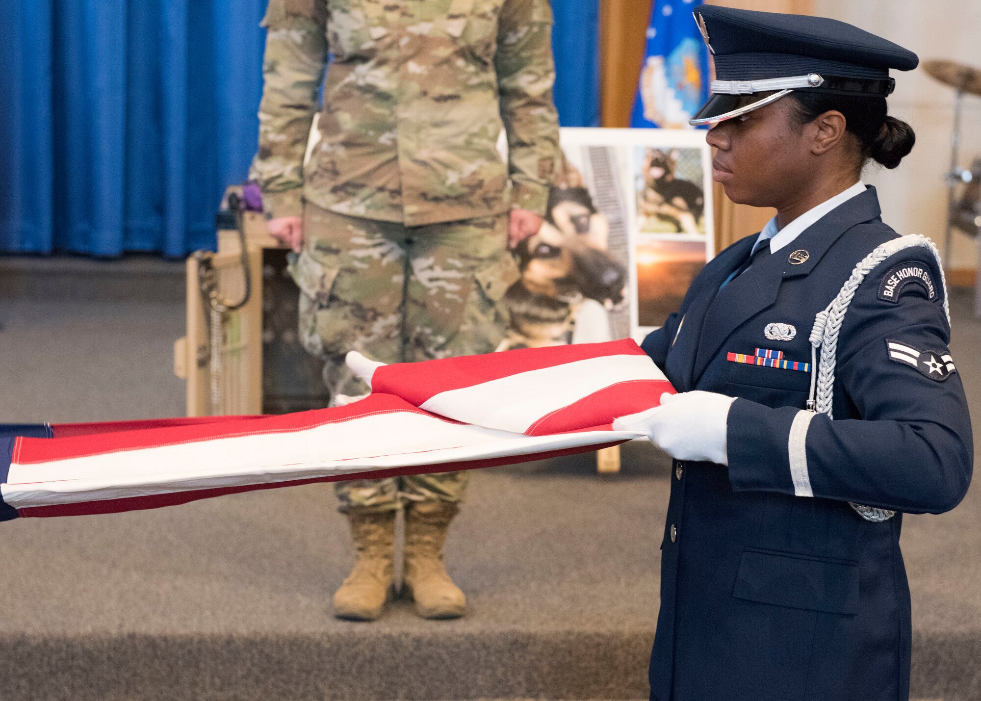 The Mountain Home Air Force Base Honor Guard performs a flag fold at a ceremony held to comemorate MWD Alf V198 September 26, 2019, at Mountain Home Air Force Base, Idaho. Alf served for six years in the United States Air Force and during that time achieved great accomplishments in support of the United States of America. (U.S Air Force photo by Senior Airman Tyrell Hall)