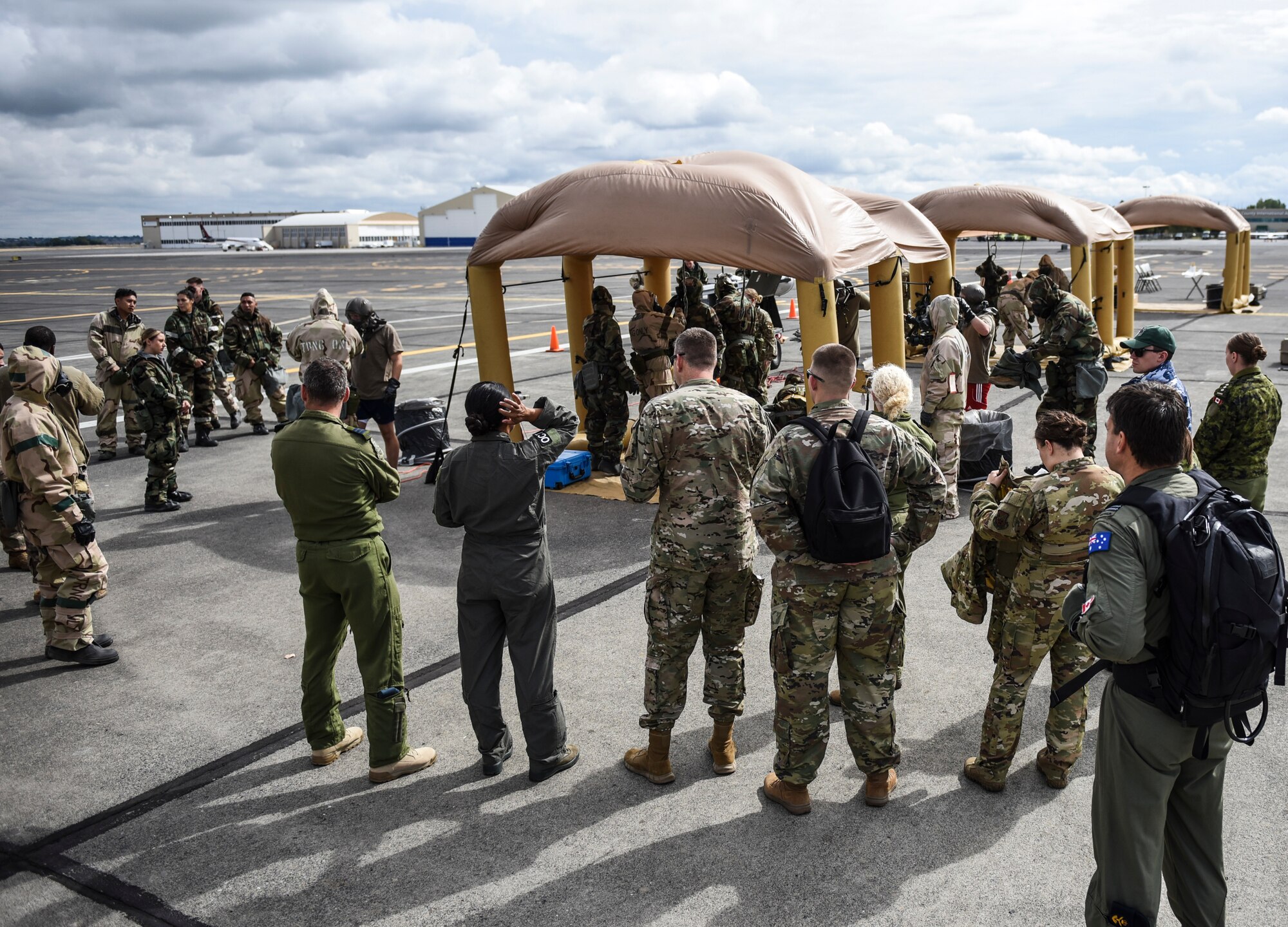 U.S. Air Force aircrew flight equipment Airmen perform decontamination procedures on KC-135 Stratotanker aircrew and passengers Sept. 16, 2019, at Yakima Air Terminal-McAllister Field, Washington, during Exercise Mobility Guardian 2019. Exercise Mobility Guardian is Air Mobility Command's premier, large scale mobility exercise.