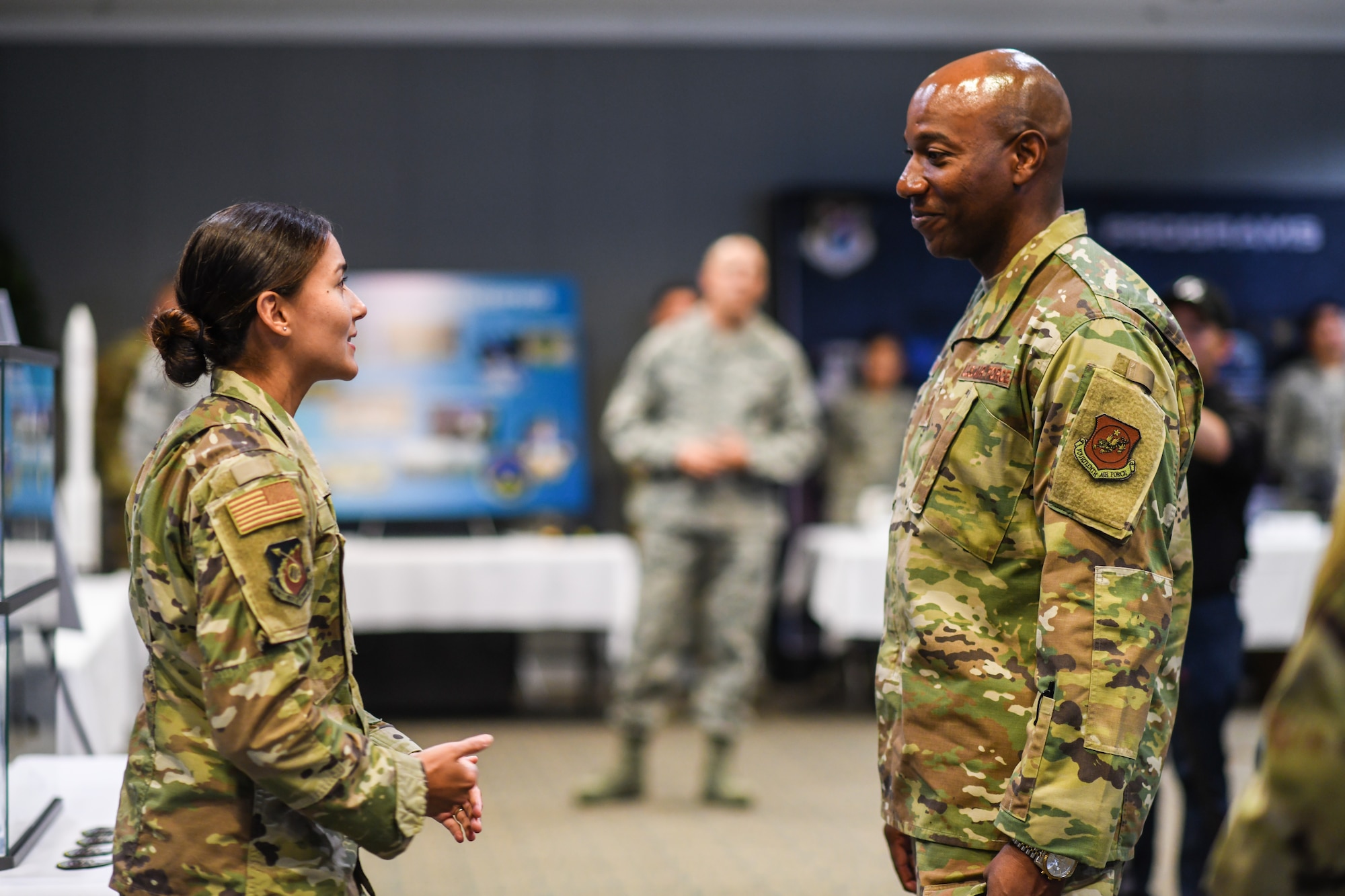 Chief Master Sgt. of the Air Force Kaleth O. Wright speaks with 1st Lt. Alejandra Mejia for a mission area briefing while visiting Los Angeles Air Force Base, El Segundo, Calif., Sept. 26, 2019. While there, he met with Airmen, received mission area briefings, and had an opportunity to view the unique characteristics of SMC and the capabilities that the total force offers to accomplish the mission at Los Angeles AFB. 
(U.S. Air Force photo by Van De Ha)