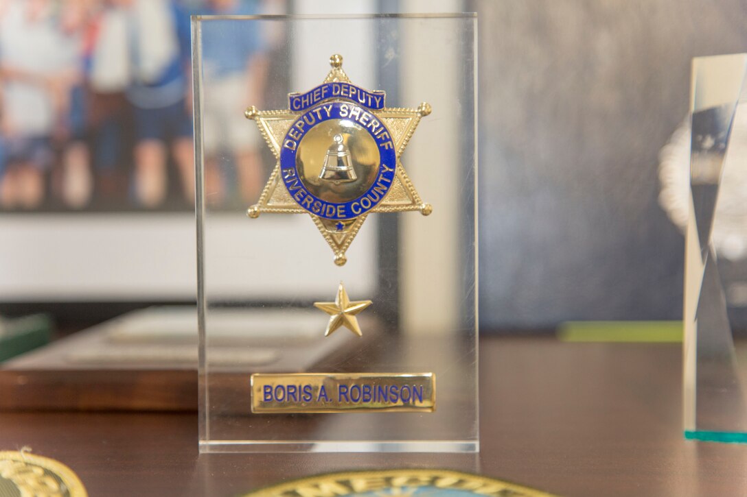 Deputy Chief Boris Robinson's Chief Deputy badge from the Riverside County Sheriff's Department captured forever in resin sits in his office at Marine Corps Logistics Base Barstow, California, Security and Emergency Services Department building 236.