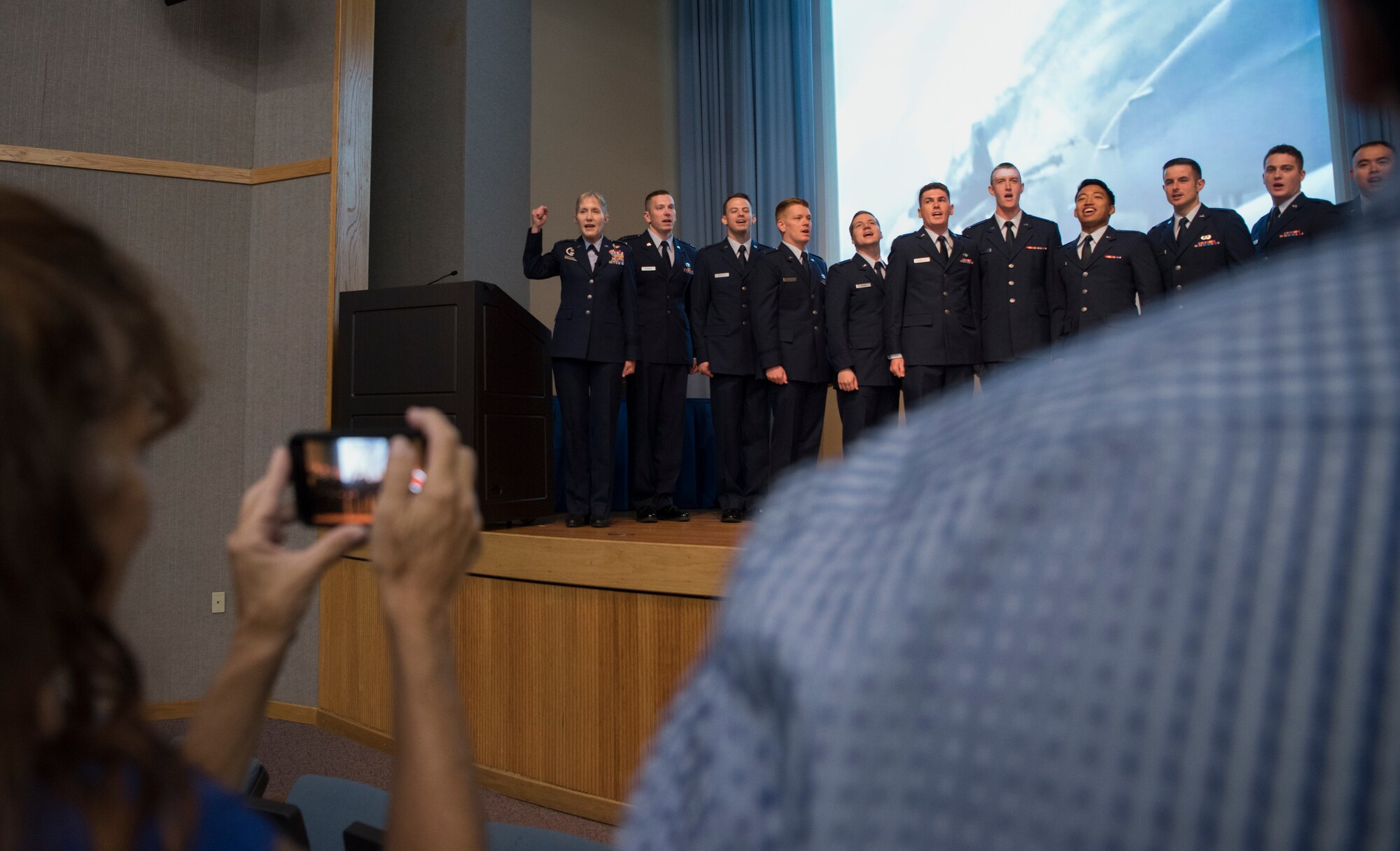 Maj. Gen. Jeannie Leavitt, Air Force Recruiting Service commander, sings the Air Force song with Specialized Undergraduate Pilot Training class 19-25 at Laughlin Air Force Base, Texas, Sept. 27, 2019. It is tradition to sing the Air Force song after every class graduation at Laughlin, and 19-25’s ceremony was no exception. Leavitt, the guest speaker at the event, is also a Laughlin SUPT graduate hailing from SUPT class 93-04. (U.S. Air Force photo by Staff Sgt. Benjamin N. Valmoja)