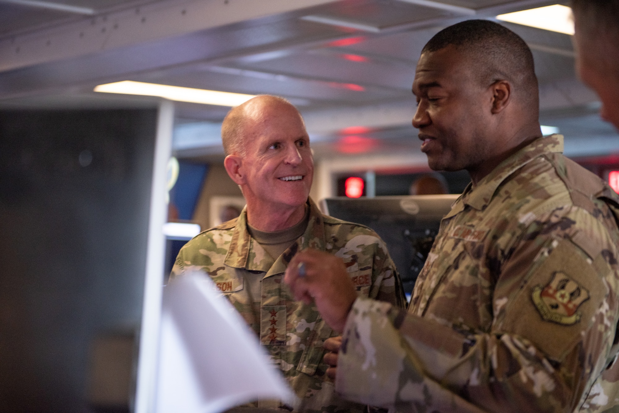 Air Force Vice Chief of Staff Gen. Stephen Wilson receives a briefing from Tech. Sgt. Mario Rogers, 727th Expeditionary Air Control Squadron, inside the Control Reporting Center Sept. 27, 2019 at Al Dhafra Air Base, United Arab Emirates. The CRC, or "Kingpin," provides air command and control capabilities of joint air operations in the U.S. Air Forces Central Command area of responsibility. (U.S. Air Force photo by Staff Sgt. Chris Thornbury)