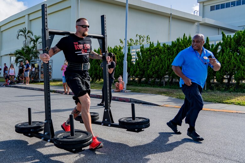 Adam Pixton executes the yoke carry during the Okinawa's Strongest: Battle of the South, Sept. 29, 2019 on Camp Foster, Okinawa, Japan.