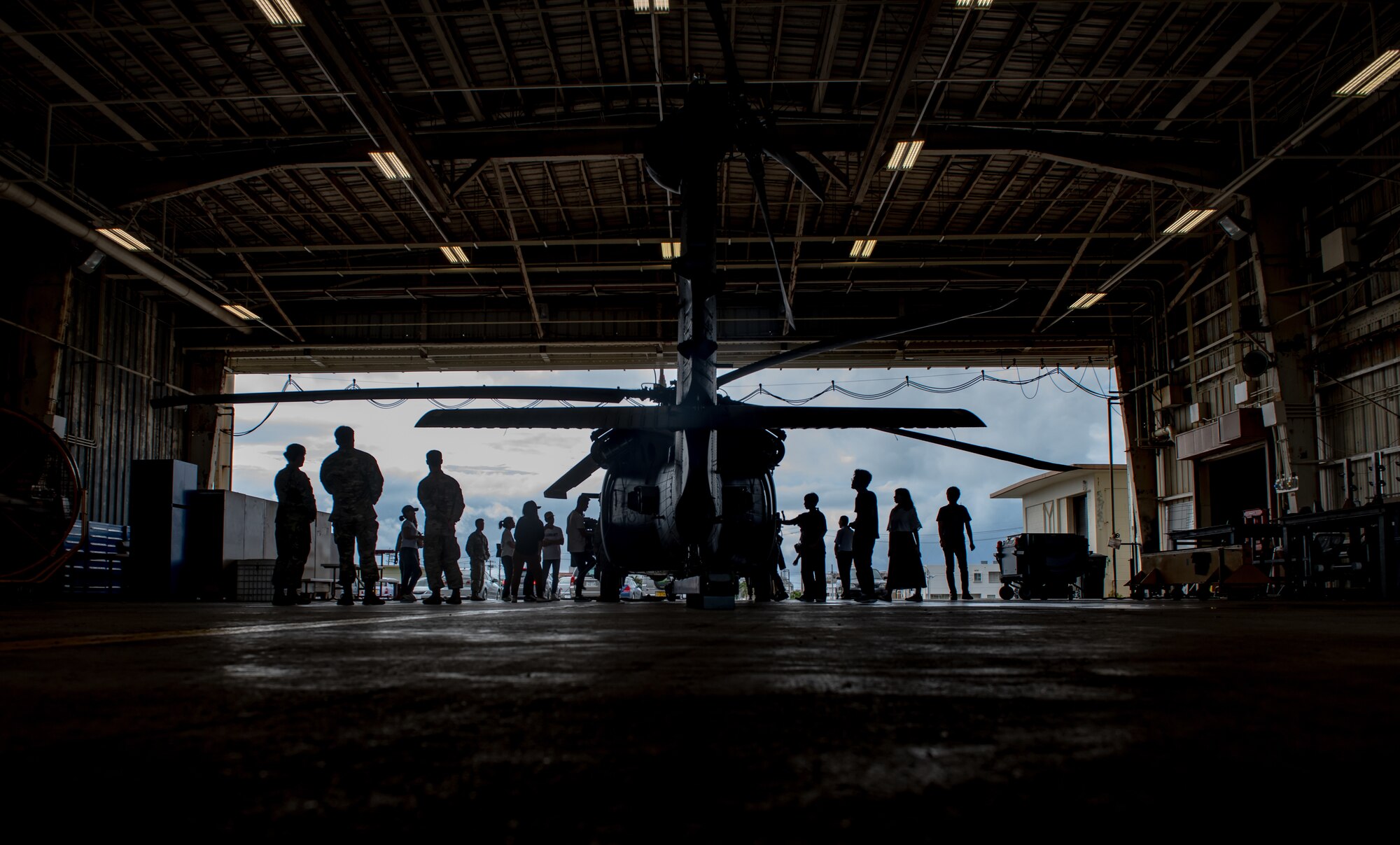 Students look at a U.S. Air Force HH-60G Pave Hawk assigned to the 33rd Rescue Squadron during Air Force Immersion Day, Sept. 23, 2019, at Kadena Air Base, Japan. During the tour, students learned about the unit’s role in supporting Airmen from the 31st Rescue Squadron in personnel recovery, humanitarian aid, disaster relief and tactical combat casualty care. (U.S. Air Force photo by Staff Sgt. Micaiah Anthony)