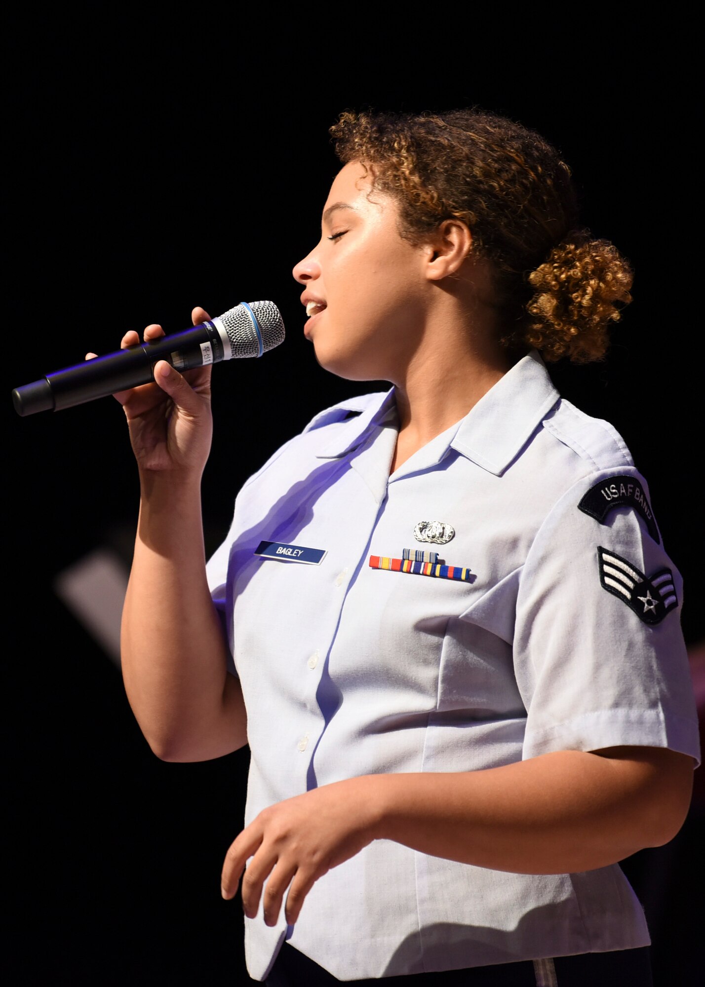 U.S. Air Force Senior Airman Christina Bagley, U.S. Air Force Band of the Pacific vocalist, sings for the Gunsan City’s Chamber of Commerce at the Dongwoo Concert Hall in Gunsan City, Republic of Korea, Sept. 26, 2019. The band played for over 200 chamber of commerce members with their families and perform for around 125,000 people every year. (U.S. Air Force photo by Staff Sgt. Anthony Hetlage)