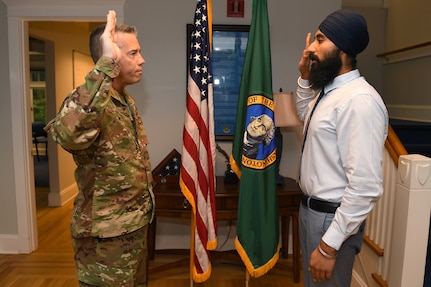 Gurchetan Singh recites the oath of enlistment with Brig. Gen. Jeremy Horn, Washington Air National Guard commander, during his enlistment into the WA ANG, Sept 27, 2019, on Camp Murray, Wash. Singh will be the first Sikh to enlist in the Air National Guard with a religious accommodation wavier that allows him to serve and still practice key elements of his religion.