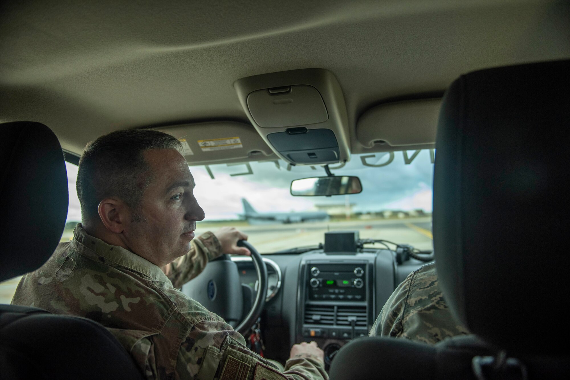 Master Sgt. Scott West, 100th Air Refueling Wing flight safety superintendent drives on the flightline to observe safety regulations are being followed at RAF Mildenhall, England, Sept. 26, 2019. The nine-person safety office is organized into three different departments: occupational safety, flight safety and weapons safety. (U.S. Air Force photo by Senior Airman Luke Milano)