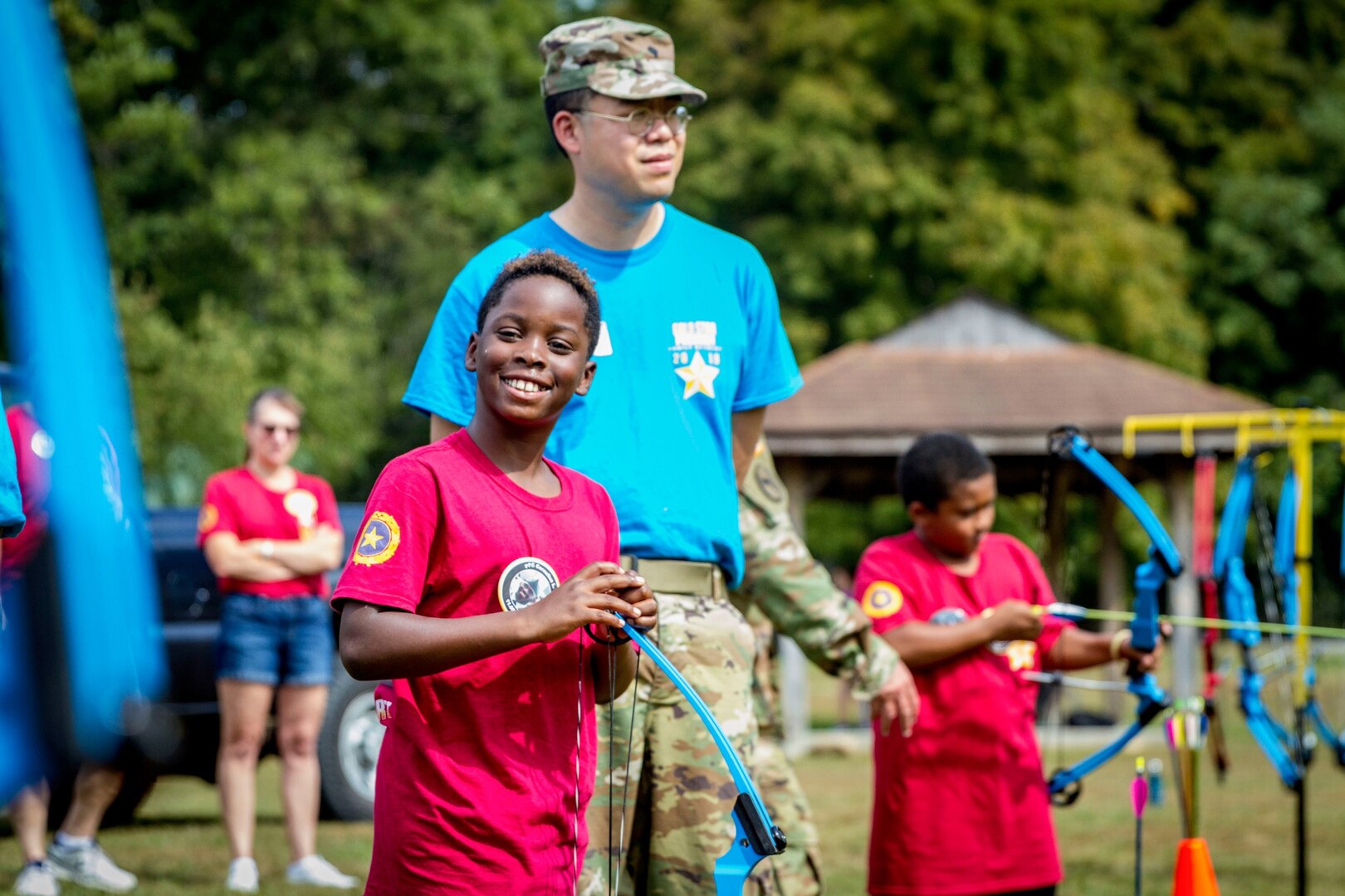 A West Virginia National Guard Solider watches as a participant of the Gold Star Families retreat takes part in an archery event Sept. 28, 2019, at Camp Dawson, W.Va. The Gold Star Families retreat is hosted each year by the WVNG to honor the service and sacrifice of Gold Star Families - those who have lost a family member in military service. (U.S. Army National Guard photo by Sgt. Zoe Morris)