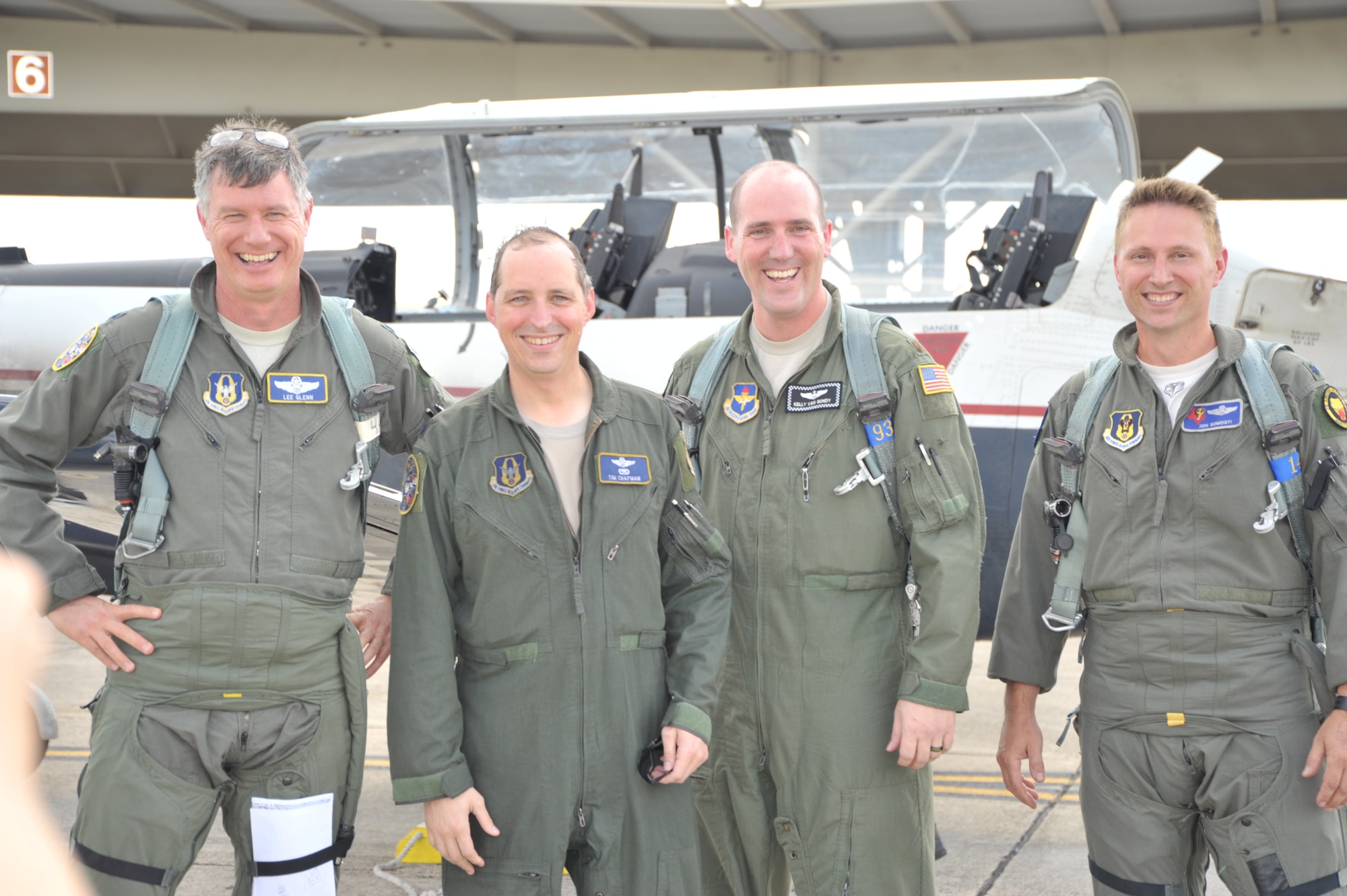 Lt. Col. Timothy Chapman, former 340th Flying Training Group Reserve Undergraduate Flying Training Program manager (second from left), poses with the three instructor pilots who flew with him during his June 18 final flight in the T-6 Texan at Joint Base San Antonio-Randolph, Texas. The fini flight and spray-down are traditional for retiring aircrew members. Pictured are Lt. Col. Glenn Lee, 340th FTG,  Chapman, Maj. Kelly Van Gundy, 12th Flying Training Wing, and Lt. Col. Jon Somogyi, 39th Flying Training Squadron. (U.S. Air Force photo by Debbie Gildea)