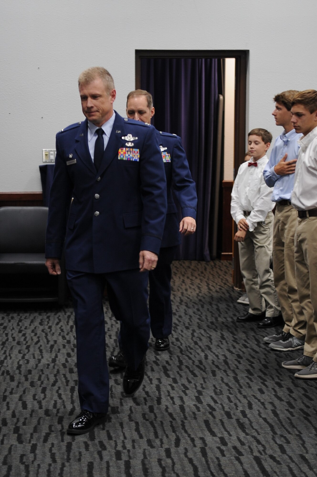 340th Flying Training Group Commander Col. Allen Duckworth leads Lt. Col. Timothy Chapman, former 340th Flying Training Group Reserve Undergraduate Flying Training Program manager to their seats on the stage in preparation for Chapman's Aug. 29 retirement ceremony conducted at Joint Base San Antonio-Randolph, Texas. Chapman was the first Air Force Reserve undergraduate flying training program manager.  (U.S. Air Force photo by Debbie Gildea)