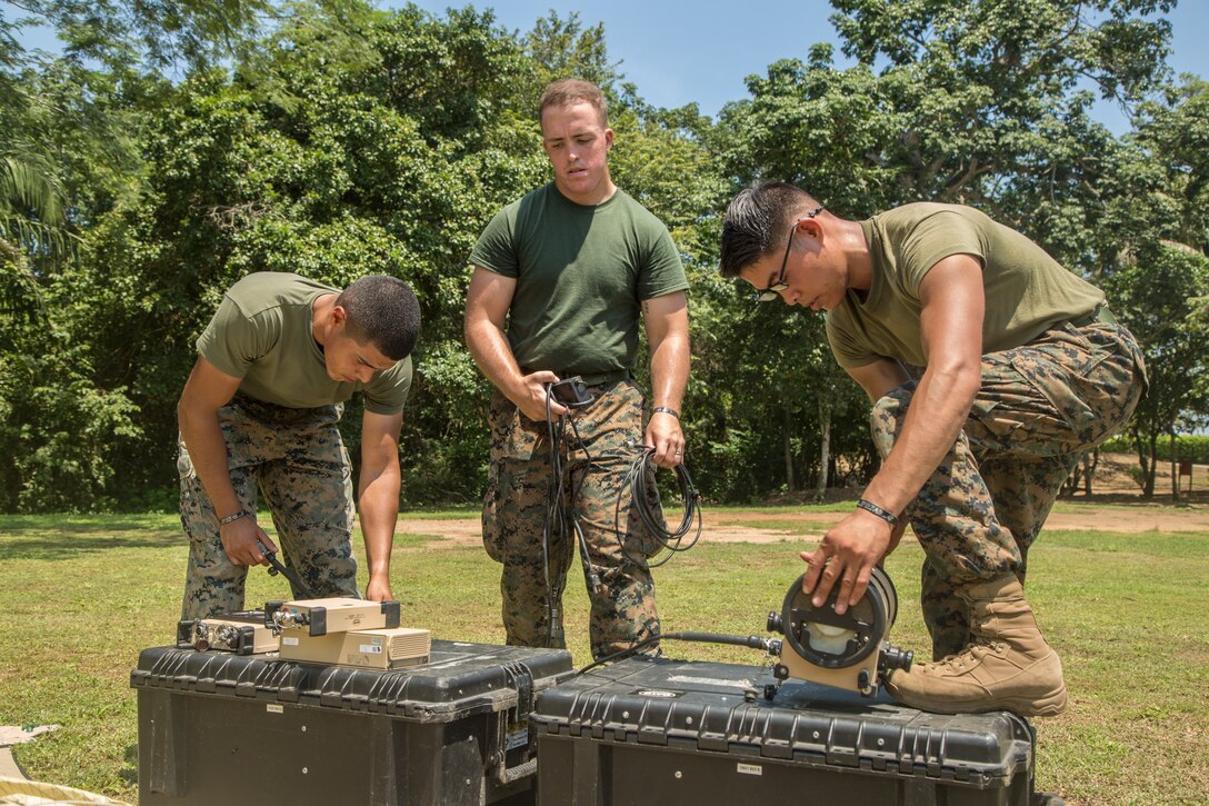 Marines set up a communications system.