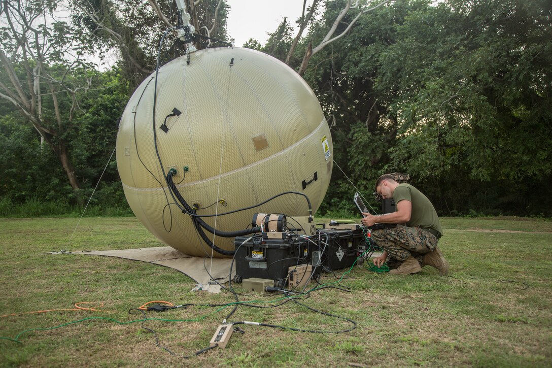 A Marine sets up a communications system