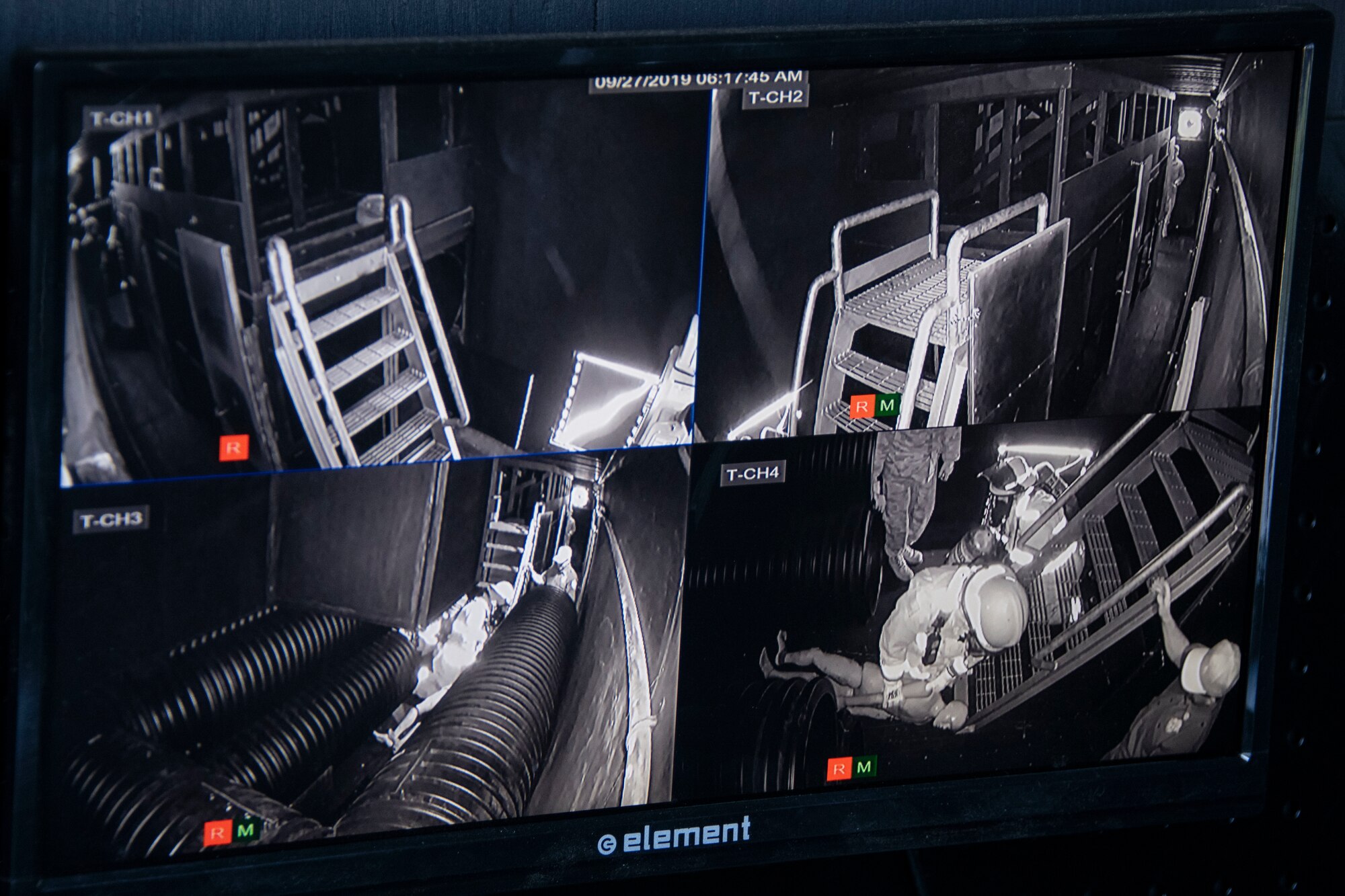 A monitor in the control room of the Confined Space Trainer shows members going through the Group Commander and Superintendents Challenge