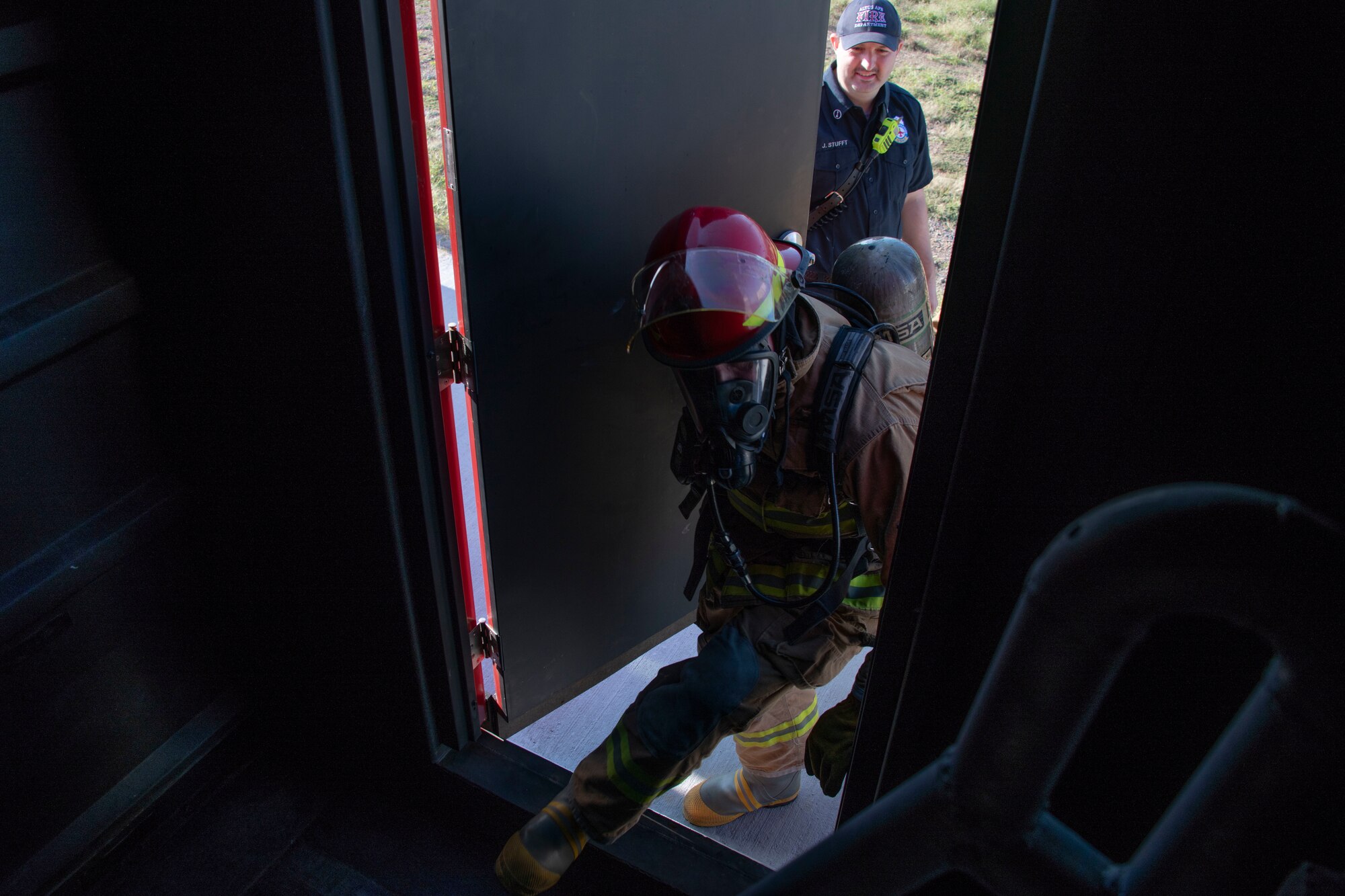 U.S. Air Force Col. William Mickley, 97th Air Mobility Wing vice commander, enters the Confined Space Trainer,