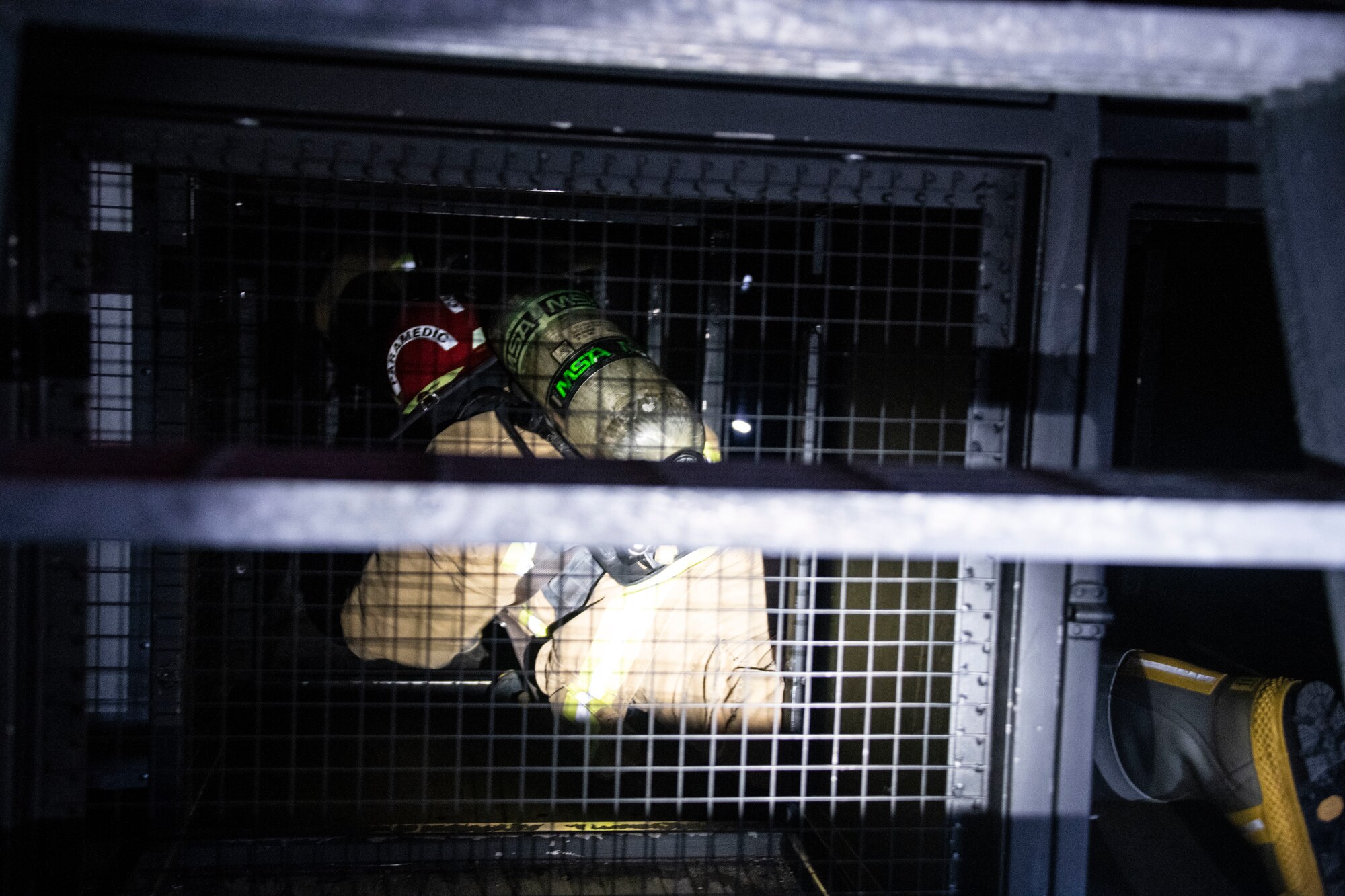 U.S. Air Force Master Sgt. Joseph Duffy, 97th Mission Support Group first sergeant, makes his way through the Confined Space Trainer