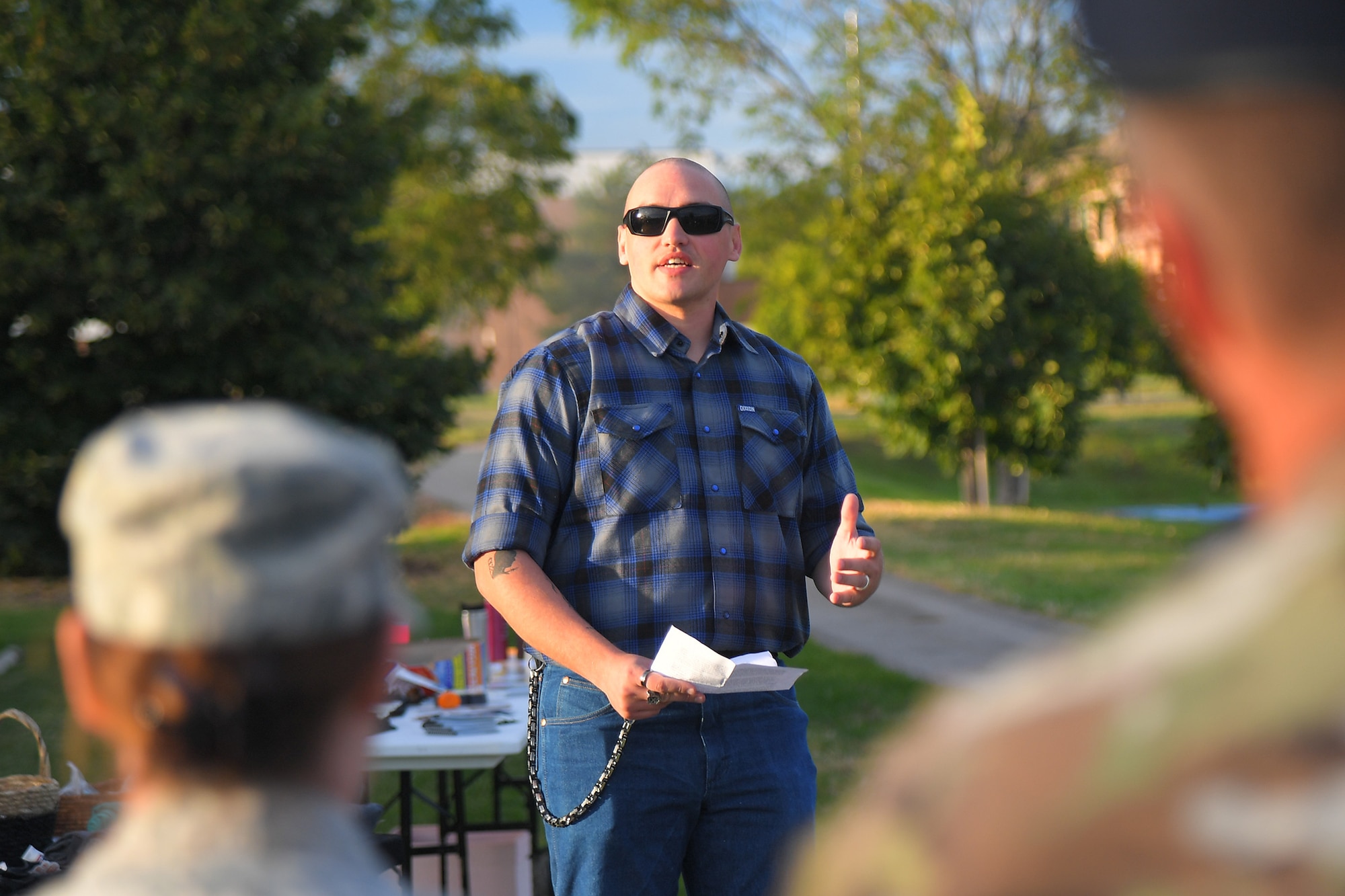 Technical Sgt. Sean Hazelip, F-22 System Program Office, addresses Airmen gathered for a Suicide Prevention Month candlelight vigil Sept. 26, 2019, at Hill Air Force Base, Utah. Hazelip shared a personal story about a time he reached out to an Airman in distress and realized after the meeting that even the smallest of kind gestures can matter to those who are suffering or in crisis. (U.S. Air Force Photo by Todd Cromar)