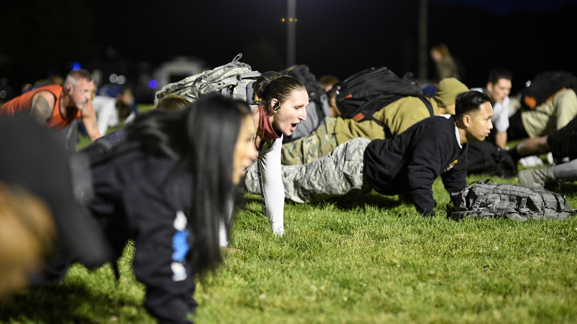 Airmen do pushups during a Suicide Prevention Month 5K ruck march/run at Hill Air Force Base, Utah, Sept. 25, 2019. (U.S. Air Force photo by R. Nial Bradshaw)