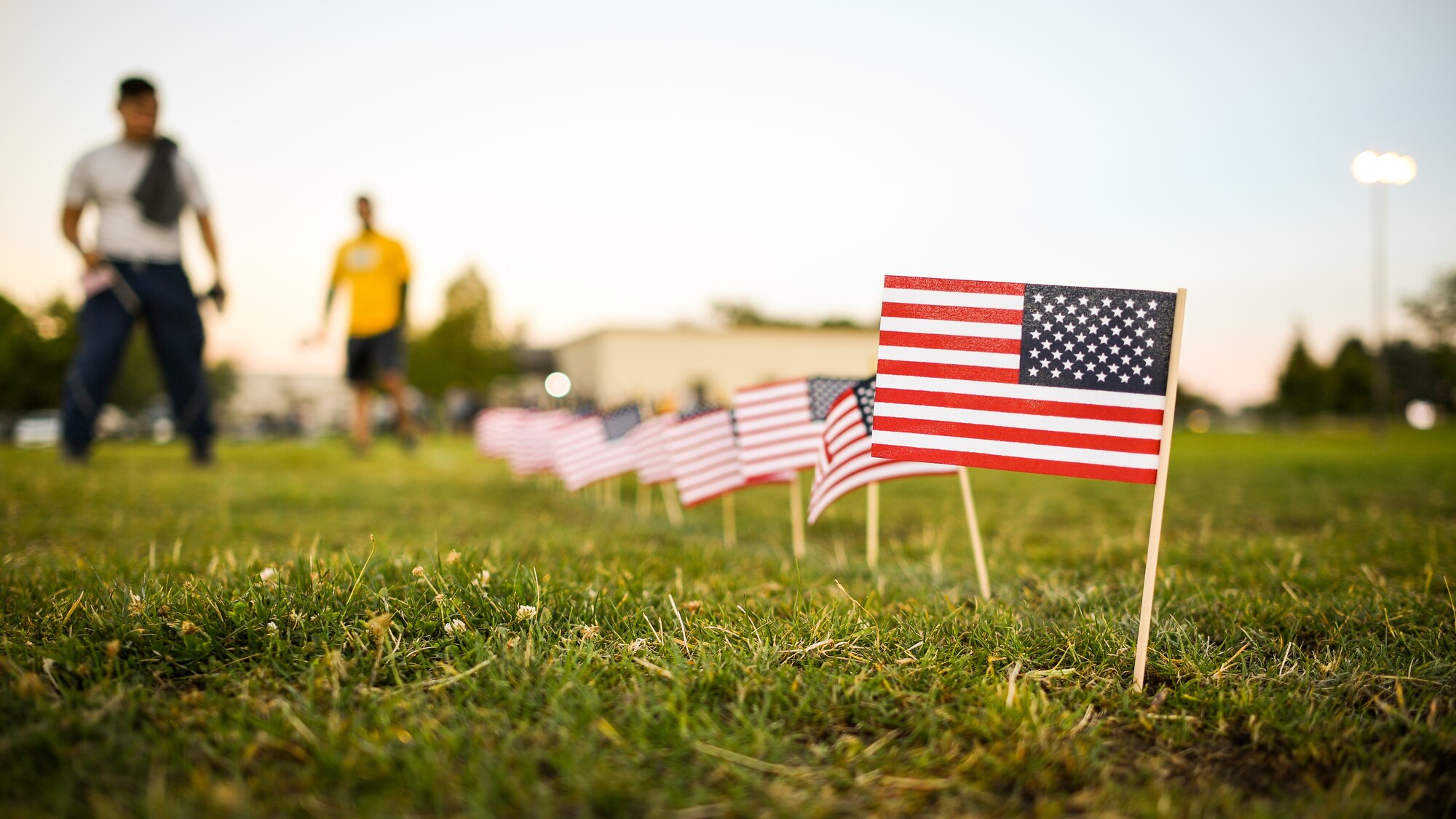 Team Hill members place flags during a Suicide Prevention Month 5K ruck march/run at Hill Air Force Base, Utah, Sept. 25, 2019. Throughout the day and during the march, Airmen placed flags in remembrance of a family member, friend or coworker who died by suicide. (U.S. Air Force photo by R. Nial Bradshaw)