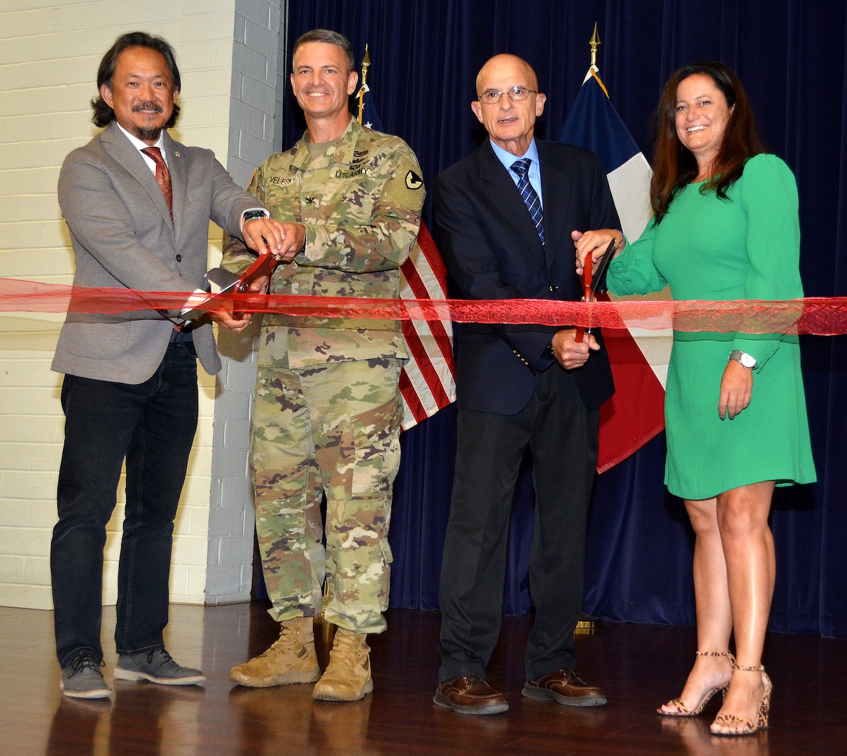 Joint Base San Antonio officials and representatives from Microsoft marked the start of a new technology career training program geared towards military spouses known as the Microsoft Military Spouse Technology Academy at a ribbon cutting at JBSA-Fort Sam Houston Military & Family Readiness Center Sept. 27. Cutting the ribbon are (from left) Danny Chung, Microsoft military affairs chief of staff; Col. Peter Velesky, JBSA and 502nd Air Base Wing deputy commander; retired Maj. Gen. Chris Cortez, Microsoft vice president of military affairs; and Elizabeth O’Brien, U.S. Chamber of Commerce senior director of Hiring Our Heroes Military Spouse Program.