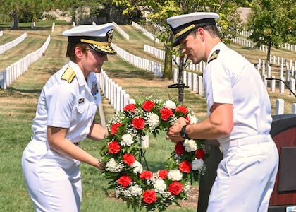 Arlington, Va. (Sept. 11, 2019) Office of Naval Intelligence (ONI) Commander Rear Adm. Kelly Aeschbach and Lt. Cmdr. Adam Seiler of the CNO-Intelligence Plot (CNO-IP) lay a memorial wreath during a September 11th Ceremony at Arlington National Cemetery.