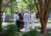 SUITLAND, Md. (Sept. 11, 2019) Office of Naval Intelligence (ONI) Commander Rear Adm. Kelly Aeschbach and retired Capt. Tom Bortmes lay a memorial wreath during a Sept. 11 remembrance ceremony at the National Maritime Intelligence Center.