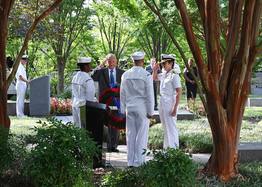 SUITLAND, Md. (Sept. 11, 2019) Office of Naval Intelligence (ONI) Commander Rear Adm. Kelly Aeschbach and retired Capt. Tom Bortmes lay a memorial wreath during a Sept. 11 remembrance ceremony at the National Maritime Intelligence Center.