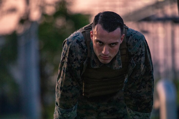 U.S. Marine Corps Sgt. Cristian Bestul, combat graphics specialist, looks on during an obstacle course physical training session as part of the Marine Corps Martial Arts Program at Marine Corps Air Station Iwakuni, Japan Sept. 25, 2019. MCMAP is an integrated, weapons based system that incorporates the full spectrum of violence and contributes to the mental, character and physical development of all Marines. Black belt focuses more on the eternal student and the ethical warrior.