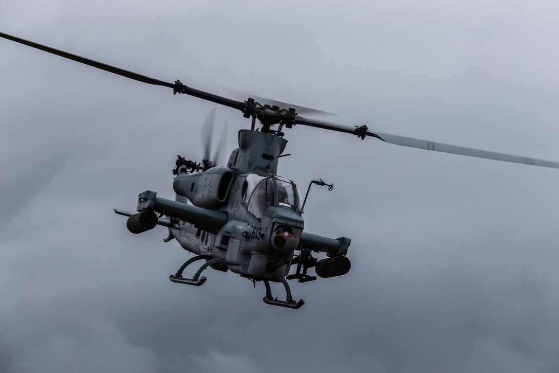 An AH-1Z Viper flies over the flight line on Marine Corps Air Station Camp Pendleton, California, Sept. 26, 2019. The air station operates and maintains a secure airfield in order to support I Marine Expeditionary Force, Marine Corps Base Camp Pendleton tenant commands and visiting units to maintain and enhance their mission capabilities and combat readiness.