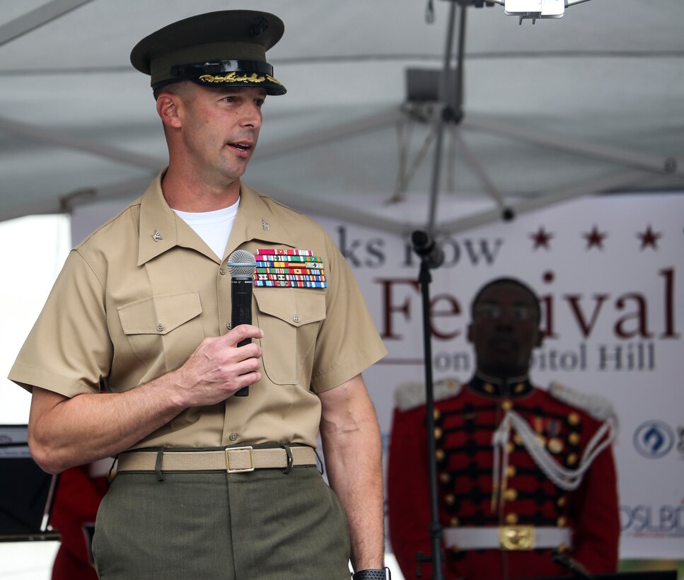 Colonel Donald J. Tomich, commanding officer, Marine Barracks Washington, D.C., speaks to the community during the 2019 Barracks Row Fall Festival in Washington, D.C., Sept. 28, 2019. The annual festival brings the community together to celebrate its rich history and support local venues. (U.S. Marine Corps photo by Sgt. Robert Knapp)