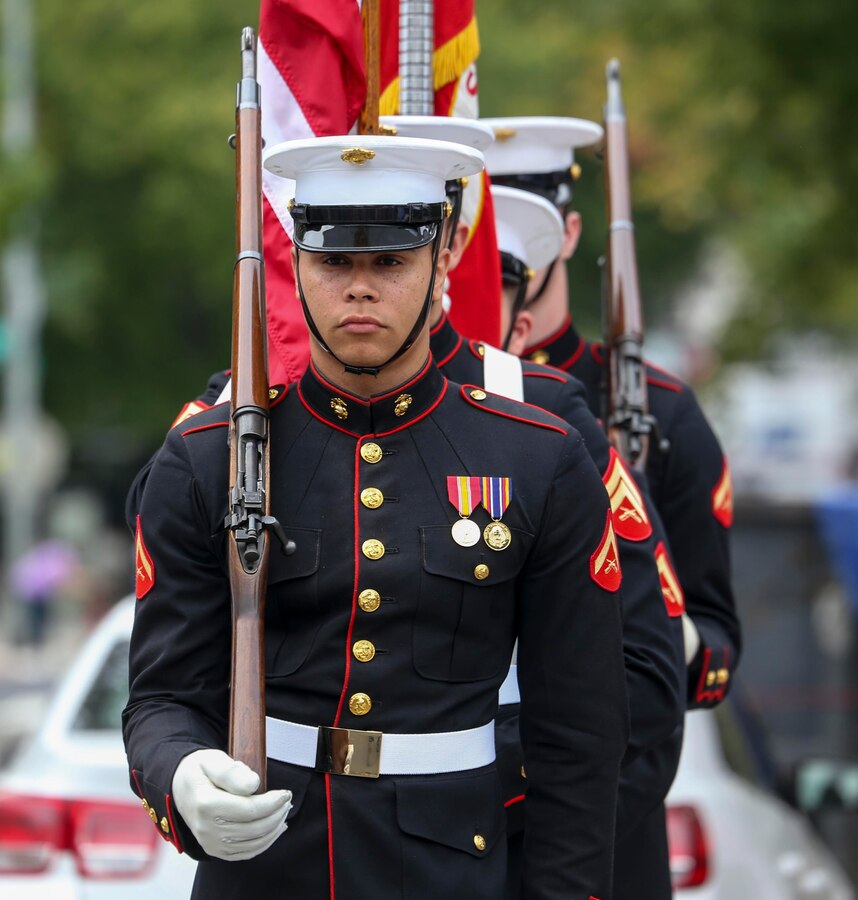 The U.S. Marine Corps Color Guard marches onto the deck during the 2019 Barracks Row Fall Festival in Washington, D.C., Sept. 28, 2019. The annual festival brings the community together to celebrate its rich history and support local venues. (U.S. Marine Corps photo by Sgt. Robert Knapp)