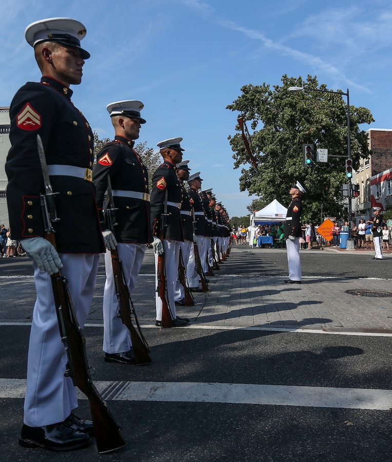 Marines with the U.S. Marine Corps Silent Drill Platoon execute their “rifle inspection” sequence during the 2019 Barracks Row Fall Festival in Washington, D.C., Sept. 28, 2019. The annual festival brings the community together to celebrate its rich history and support local venues. (U.S. Marine Corps photo by Sgt. Robert Knapp)