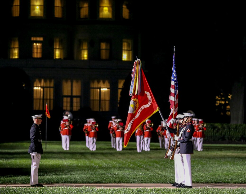 Marines with the U.S. Marine Corps Color Guard present the National Ensign during a retirement ceremony for Gen. Thomas D. Waldhauser at Marine Barracks Washington, D.C., Sept 27, 2019. General Waldhauser served as an infantry officer at all levels in the Corps, including command of the 15th Marine Expeditionary Unit (Special Operations Capable) during combat operations in Afghanistan and Iraq. His General Officer commands included the Marine Corps Warfighting Laboratory, 1st Marine Division, I Marine Expeditionary Force, and Commander, Marine Corps Forces Central Command. He retired after more than 43 years of dedicated and faithful service to our Corps. (U.S. Marine Corps photo by Cpl. James Bourgeois)