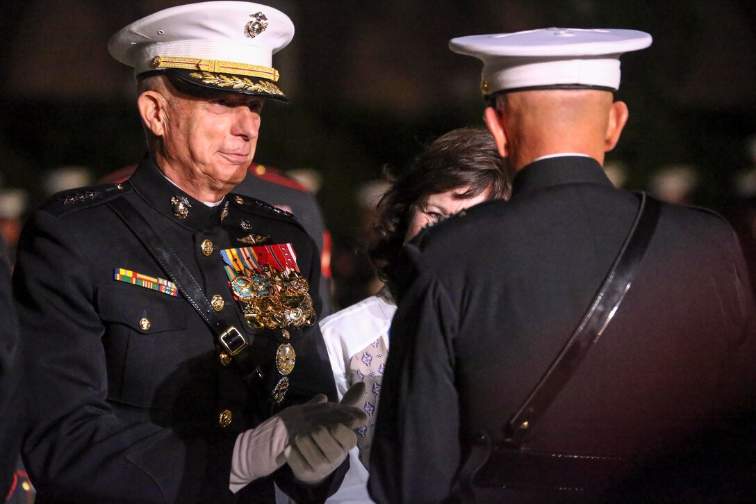 Gen. Thomas D. Waldhauser, commander, U.S. Africa Command, applauds Commandant of the Marine Corps, Gen. David H. Berger, during his retirement ceremony at Marine Barracks Washington, D.C., Sept 27, 2019. General Waldhauser served as an infantry officer at all levels in the Corps, including command of the 15th Marine Expeditionary Unit (Special Operations Capable) during combat operations in Afghanistan and Iraq. His General Officer commands included the Marine Corps Warfighting Laboratory, 1st Marine Division, I Marine Expeditionary Force, and Commander, Marine Corps Forces Central Command. He retired after more than 43 years of dedicated and faithful service to our Corps. (U.S. Marine Corps photo by Sgt. Robert Knapp)