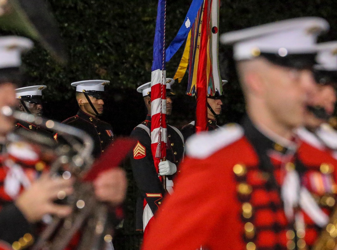 Marines with the U.S. Marine Corps Color Guard stand at the position of attention during a retirement ceremony for Gen. Thomas D. Waldhauser, commander, U.S. Africa Command, at Marine Barracks Washington, D.C., Sept 27, 2019. General Waldhauser served as an infantry officer at all levels in the Corps, including command of the 15th Marine Expeditionary Unit (Special Operations Capable) during combat operations in Afghanistan and Iraq. His General Officer commands included the Marine Corps Warfighting Laboratory, 1st Marine Division, I Marine Expeditionary Force, and Commander, Marine Corps Forces Central Command. He retired after more than 43 years of dedicated and faithful service to our Corps. (U.S. Marine Corps photo by Sgt. Robert Knapp)