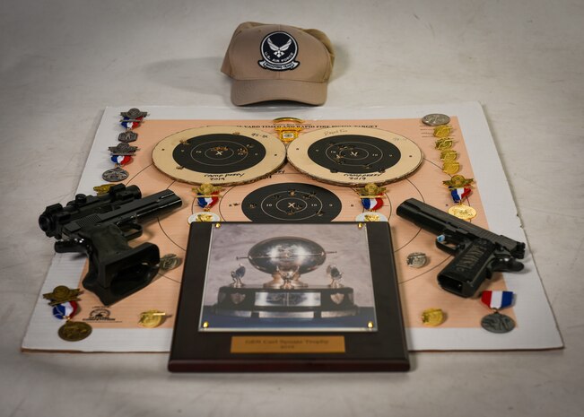 Awards are displayed on the ground.