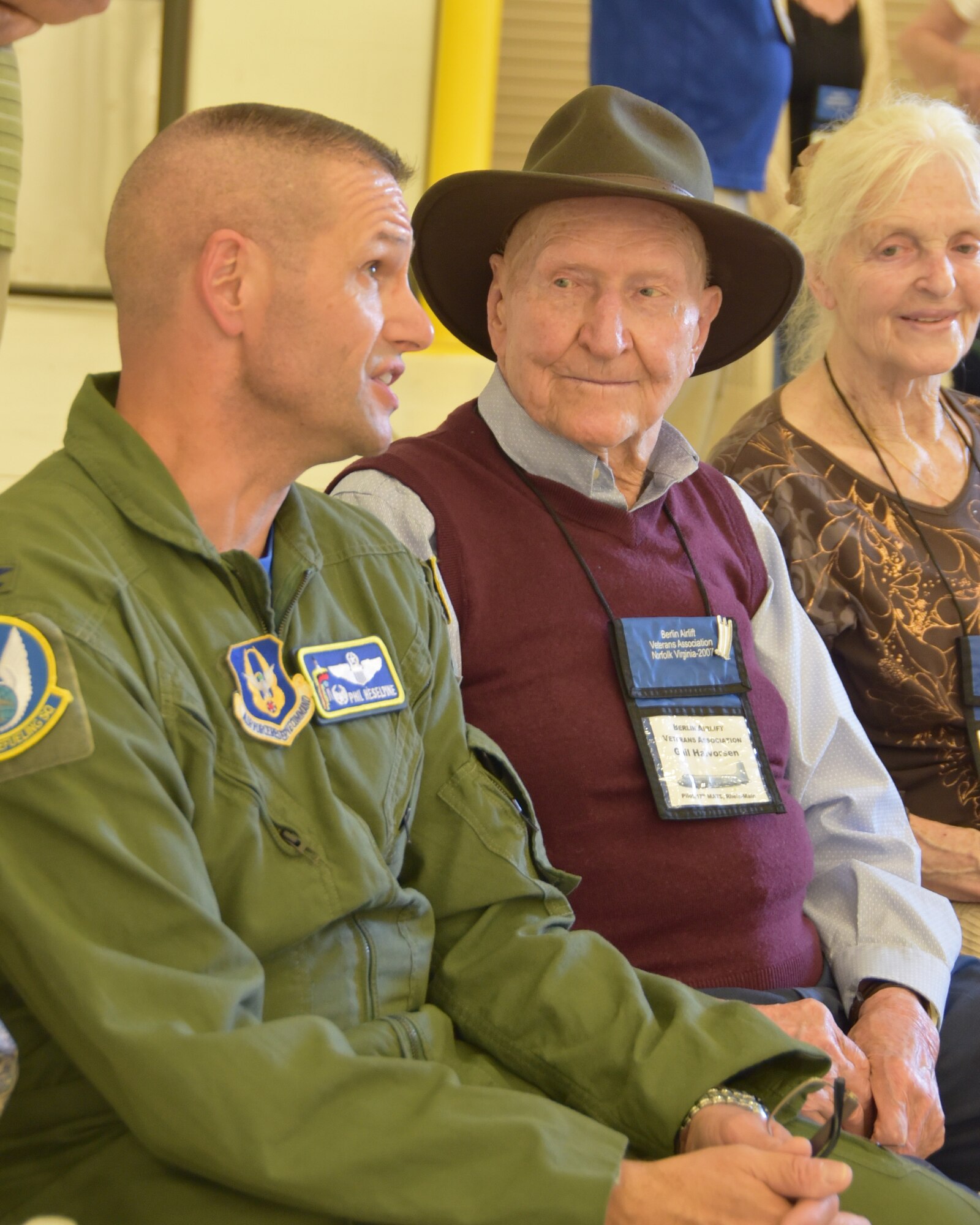 Col. Phil Heseltine, 931st Air Refueling Wing commander, speaks with retired Col.Gail S. Halvorsen, known commonly as the Berlin "Candy Bomber," Sept. 27, 2019, McConnell Air Force Base, Kan. During the Berlin Airlift Halvorsen dropped candy bars attached to parachutes made from handkerchiefs to German children watching the airlift operations from outside the fence of the Tempelhof Airport in West Berlin. The Berlin Airlift was a humanitarian airlift effort that broke the Soviet Union’s blockade of West Berlin, shattering  previous airlift records.
