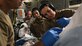 A critical care air transport team tends to a patient during a 20-hour direct flight from Bagram Airfield, Afghanistan, to San Antonio, Texas, Aug. 18, 2019. The service member was cared for by a joint service team of extracorporeal membrane oxygenation specialists, an aeromedical evacuation team, as well as a CCATT, in order to maintain the highest level of care possible during transport. (U.S. Air Force photo by Airman 1st Class Ryan Mancuso)