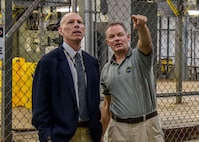 Naval Surface Warfare Center, Philadelphia Division (NSWCPD) engineer Andy Cairns and Naval Surface Warfare Center, Indian Head Explosive Ordinance Disposal Technology Division (NSWC IHEODTD Technical Director Ashley Johnson tour the DDG 51 Land Based Engineering Test Site on Sept. 16. NSWCPD’s Technical Director Thomas Perotti swapped places with NSWC IHEODTD’s Technical Director Ashley Johnson to learn more about each Command’s mission, leverage lessons learned, and identify new ways the two warfare centers could collaborate. (U.S. Navy photo by Keegan Rammel)